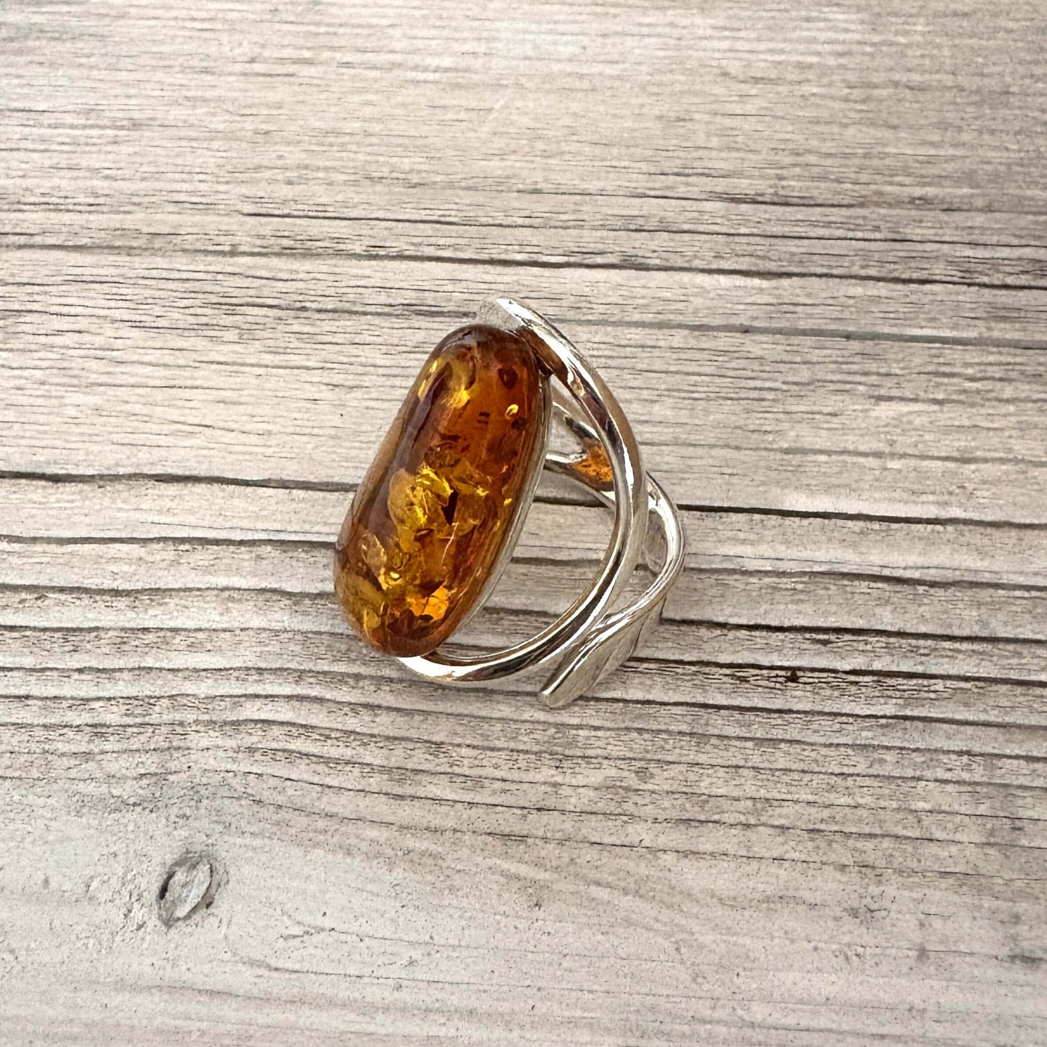 oval shaped adjustable amber ring set in sterling silver