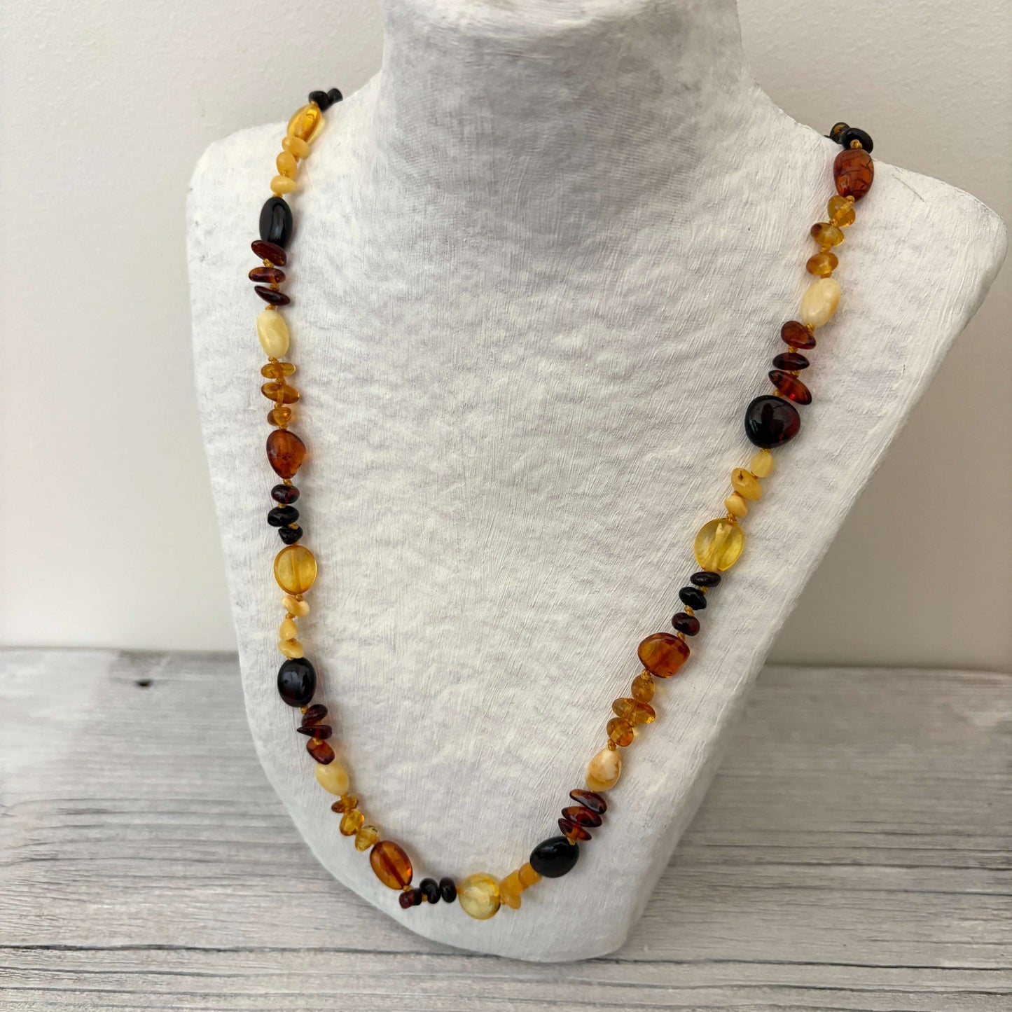 polished beaded mixed coloured amber necklace side