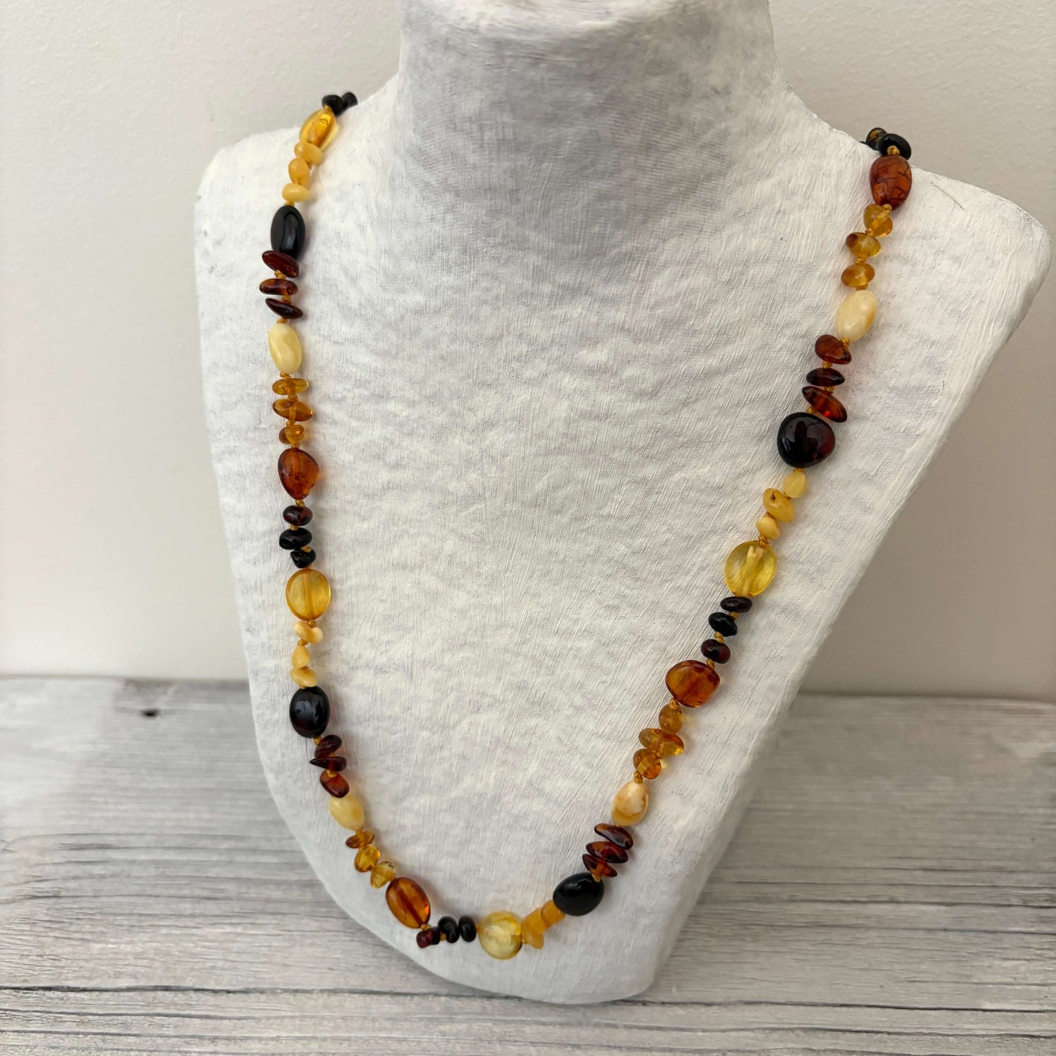 polished beaded mixed coloured amber necklace side