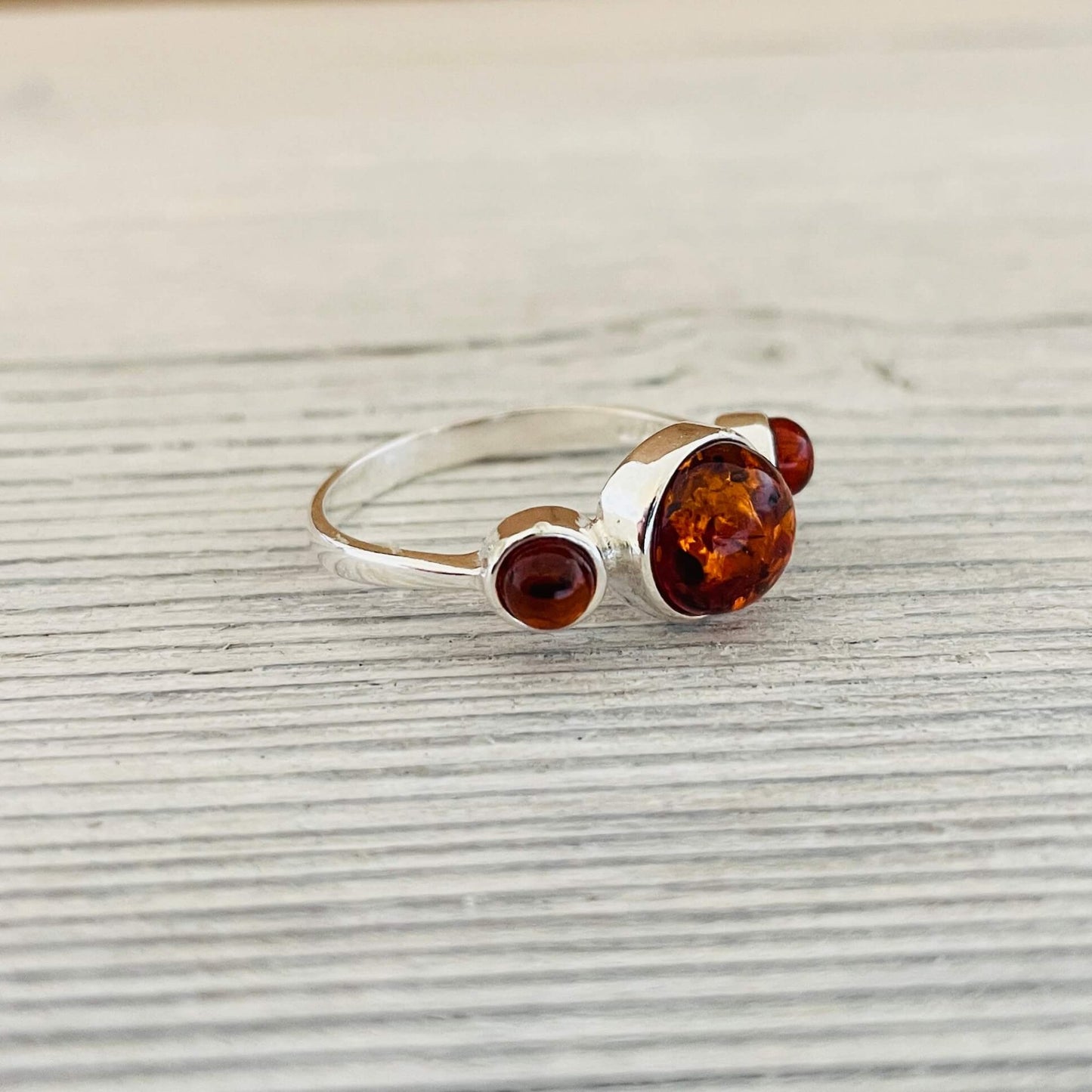 round shaped amber ring set in sterling