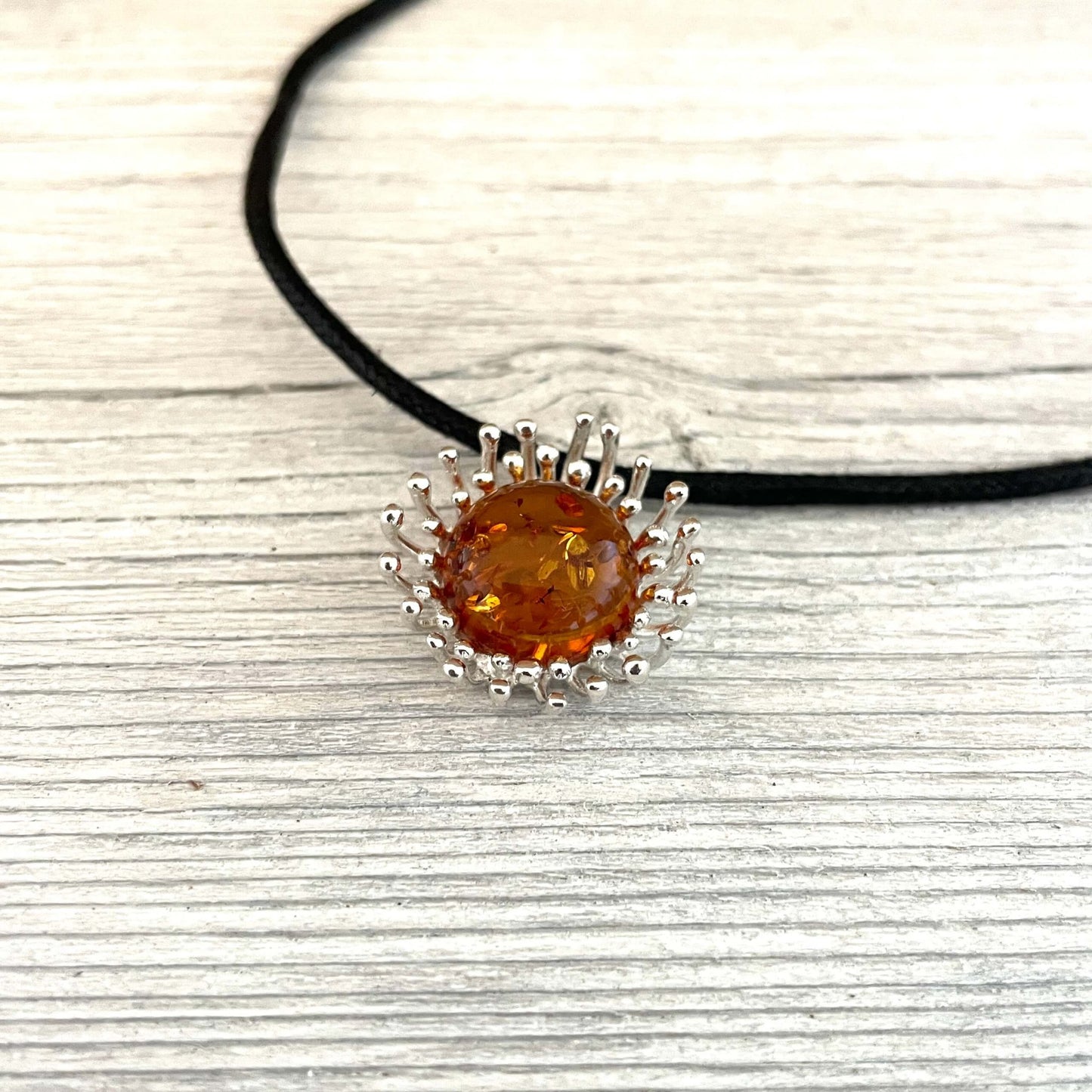 round shaped cognac amber pendant