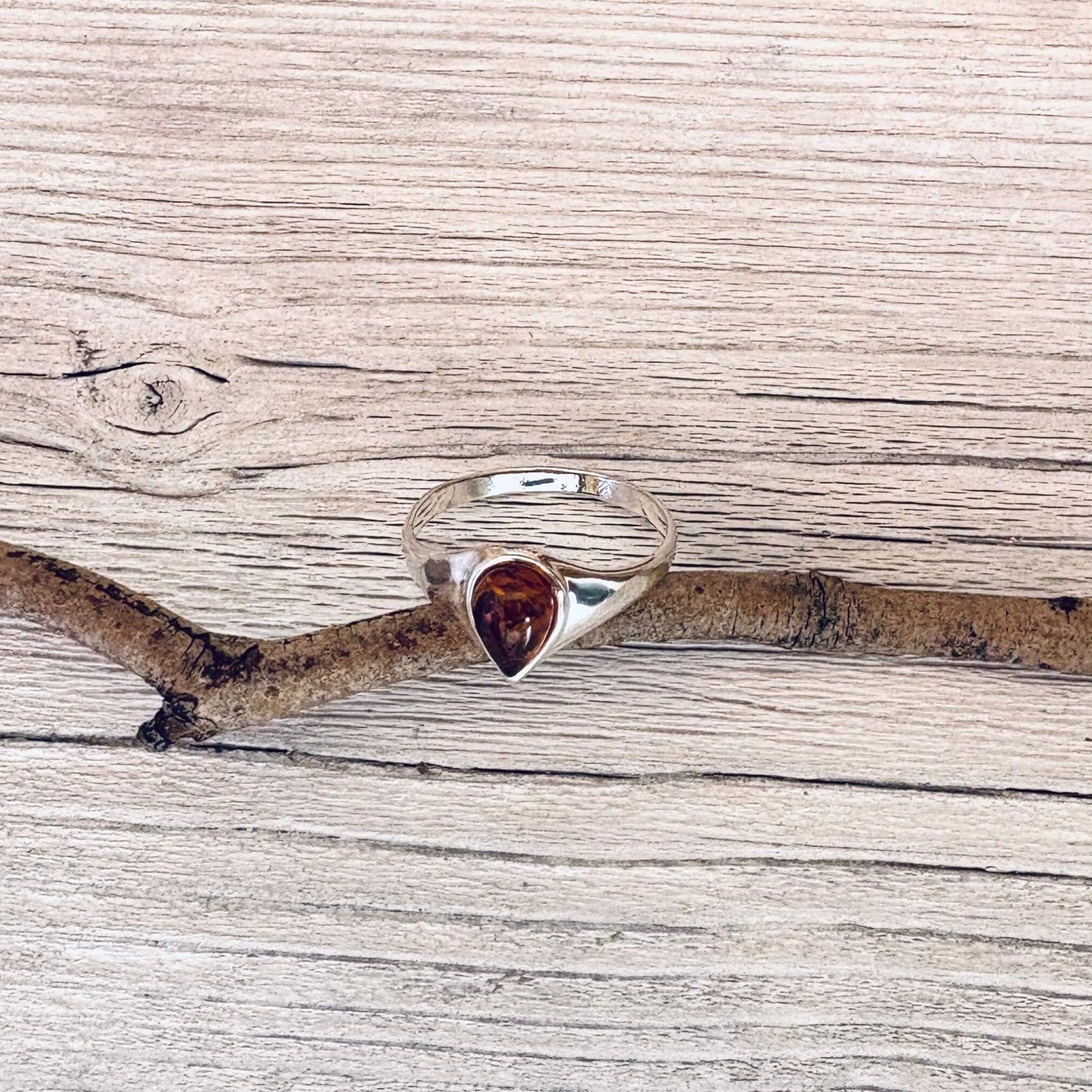 teardrop shaped cognac amber ring set in sterling silver