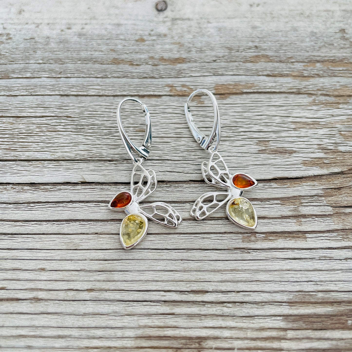 cognac and yellow amber set in butterfly shaped sterling silver earrings