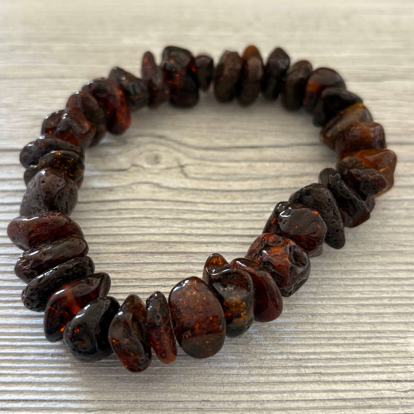 Brown beaded bracelet on a textured surface