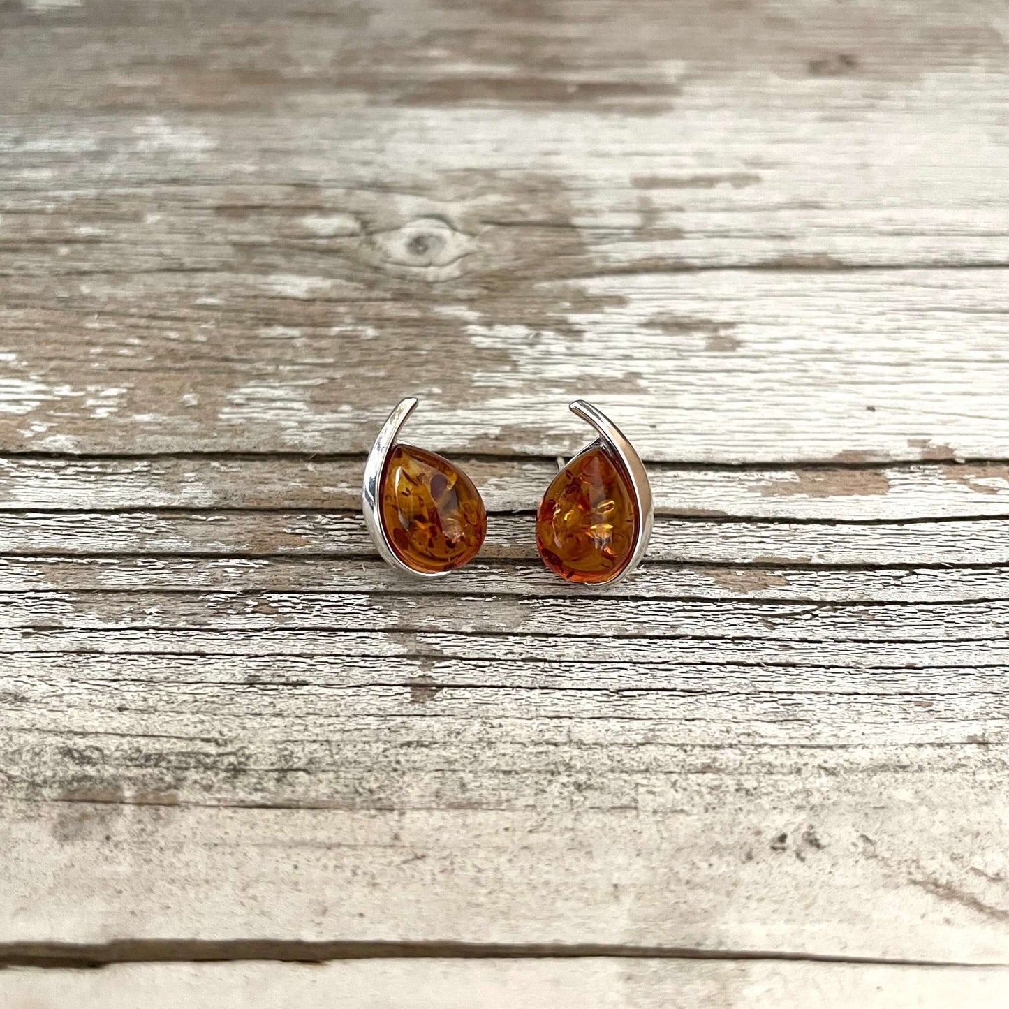 tear drop shaped cognac amber earrings set in sterling silver