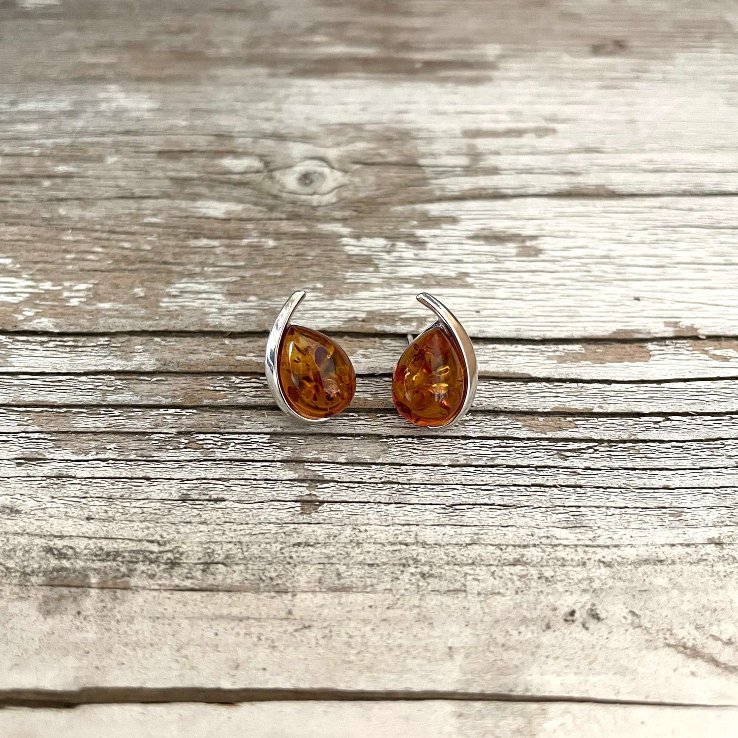 tear drop shaped cognac amber earrings set in sterling silver