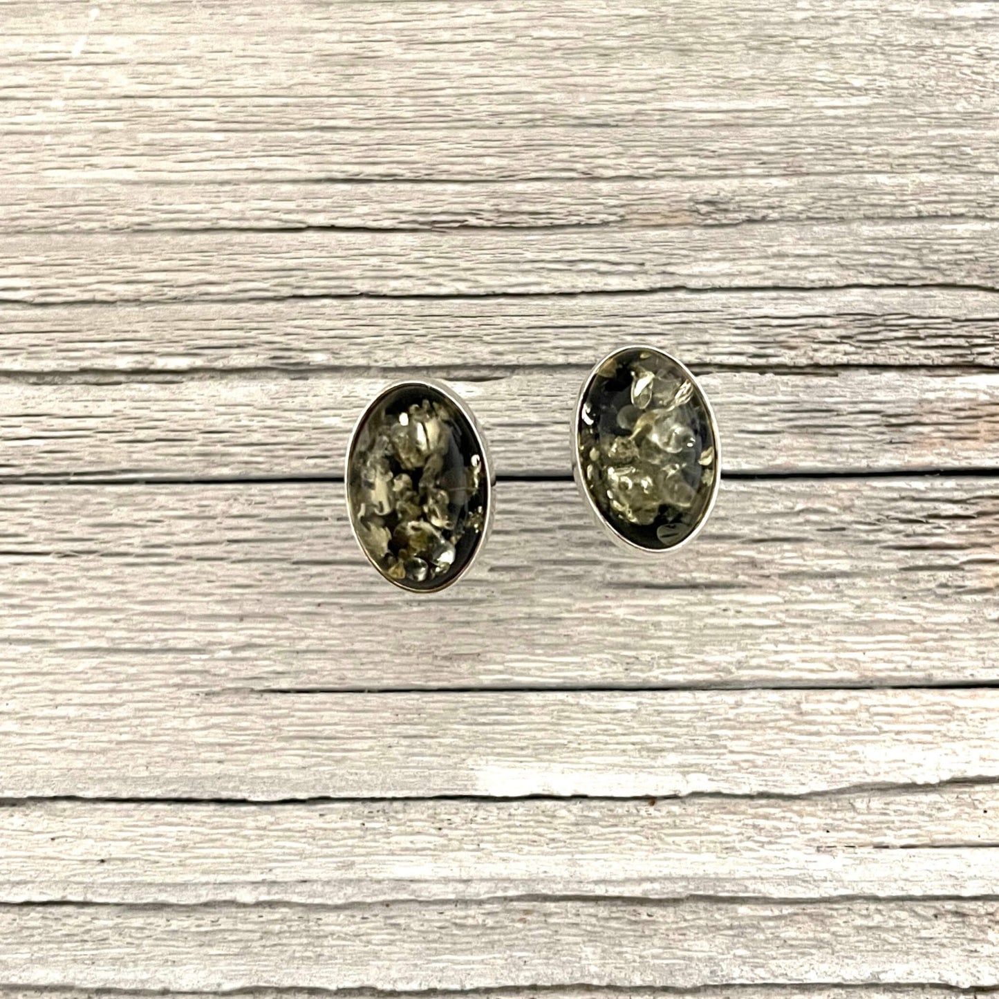 oval shaped green amber stud earrings