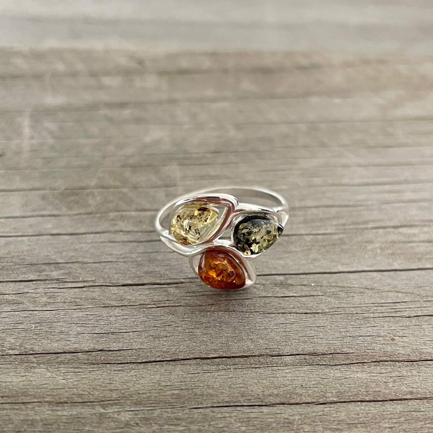 egg shaped yellow green and cognac amber silver ring