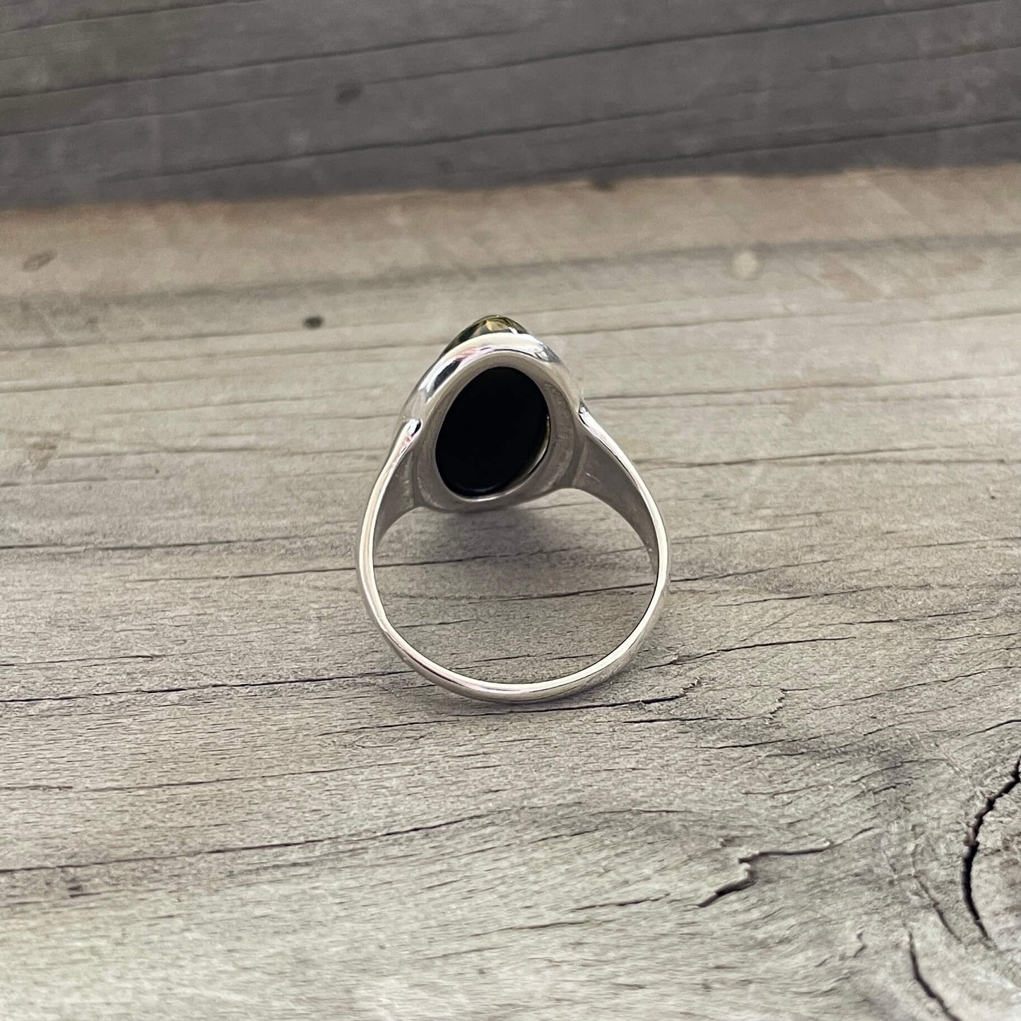 oval shaped green amber ring set in sterling silver back side