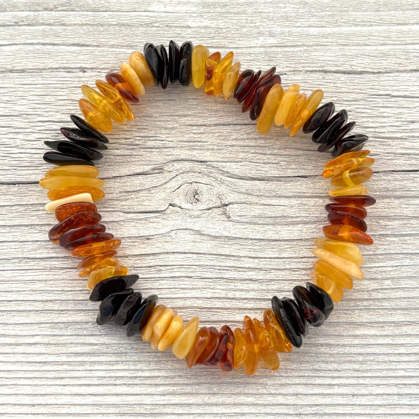 Multicolored beaded bracelet on a wooden surface