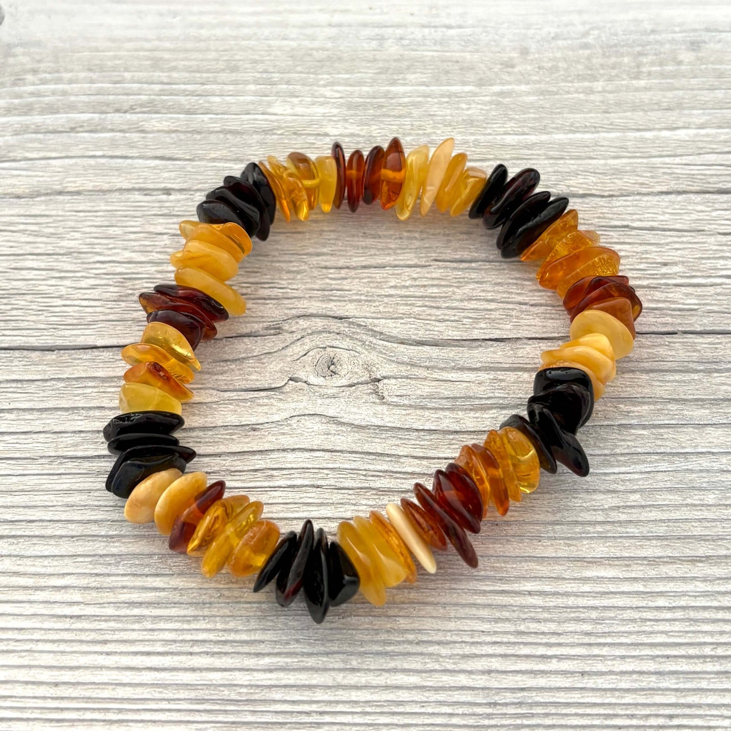 Multicolored beaded bracelet on a wooden surface