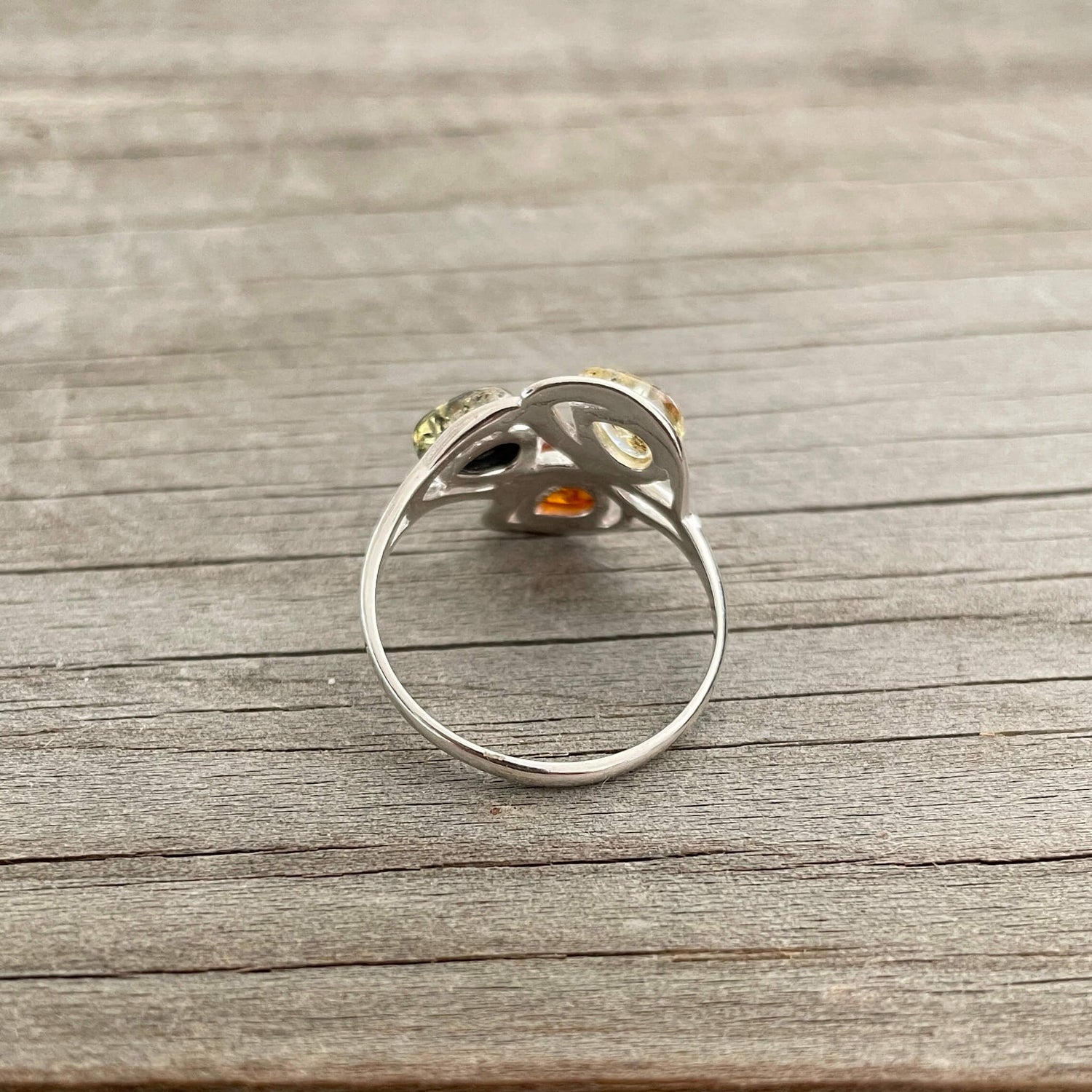 egg shaped yellow green and cognac amber silver ring