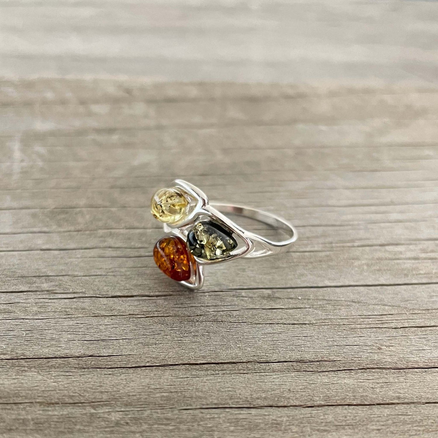 egg shaped yellow green and cognac amber silver ring