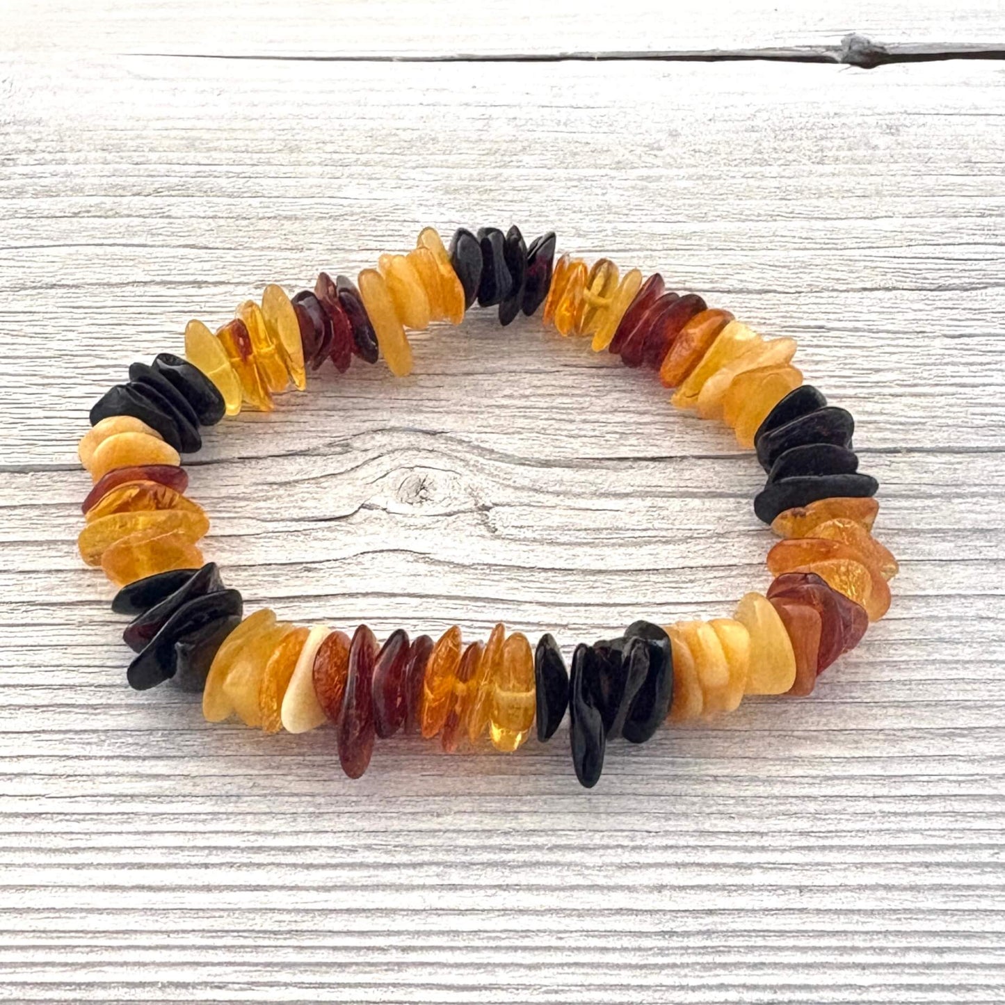 Multicolored beaded bracelet on a wooden surface