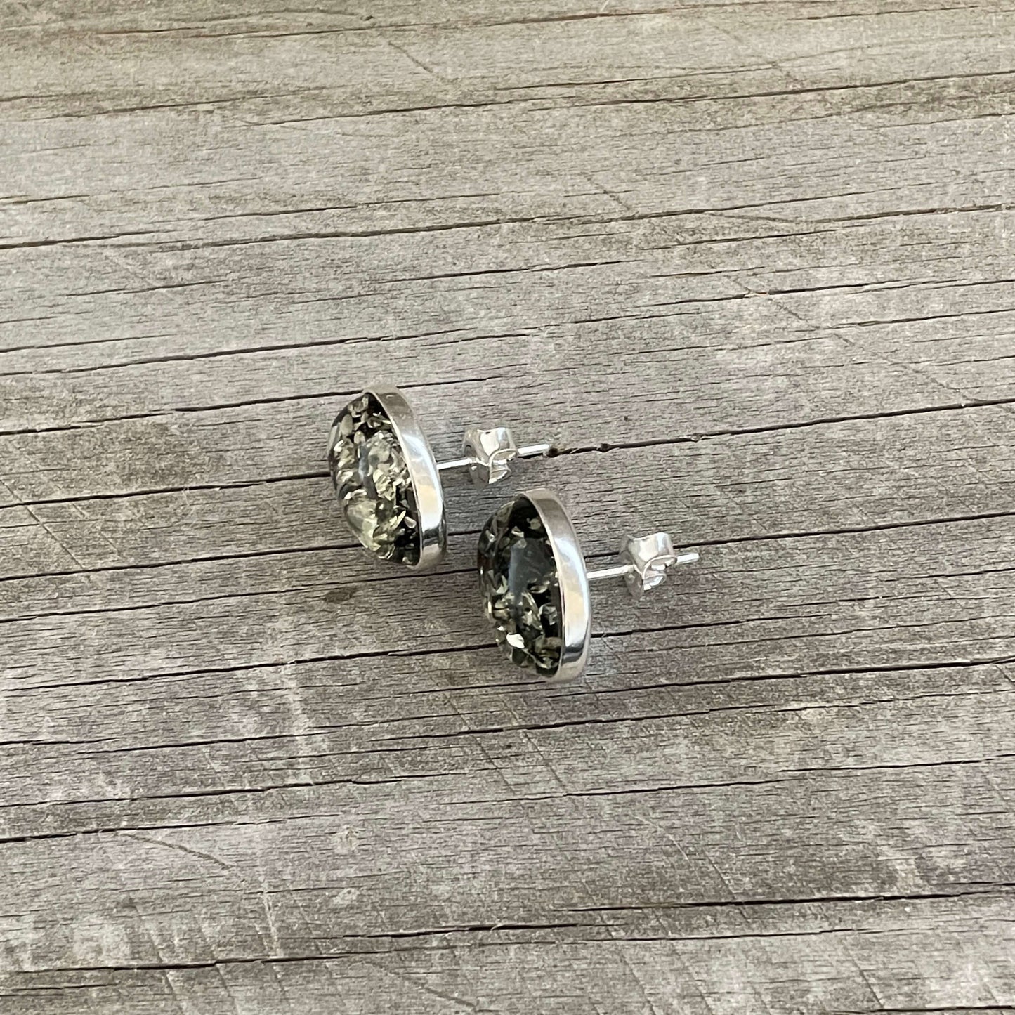 oval shaped polished green amber stud earrings