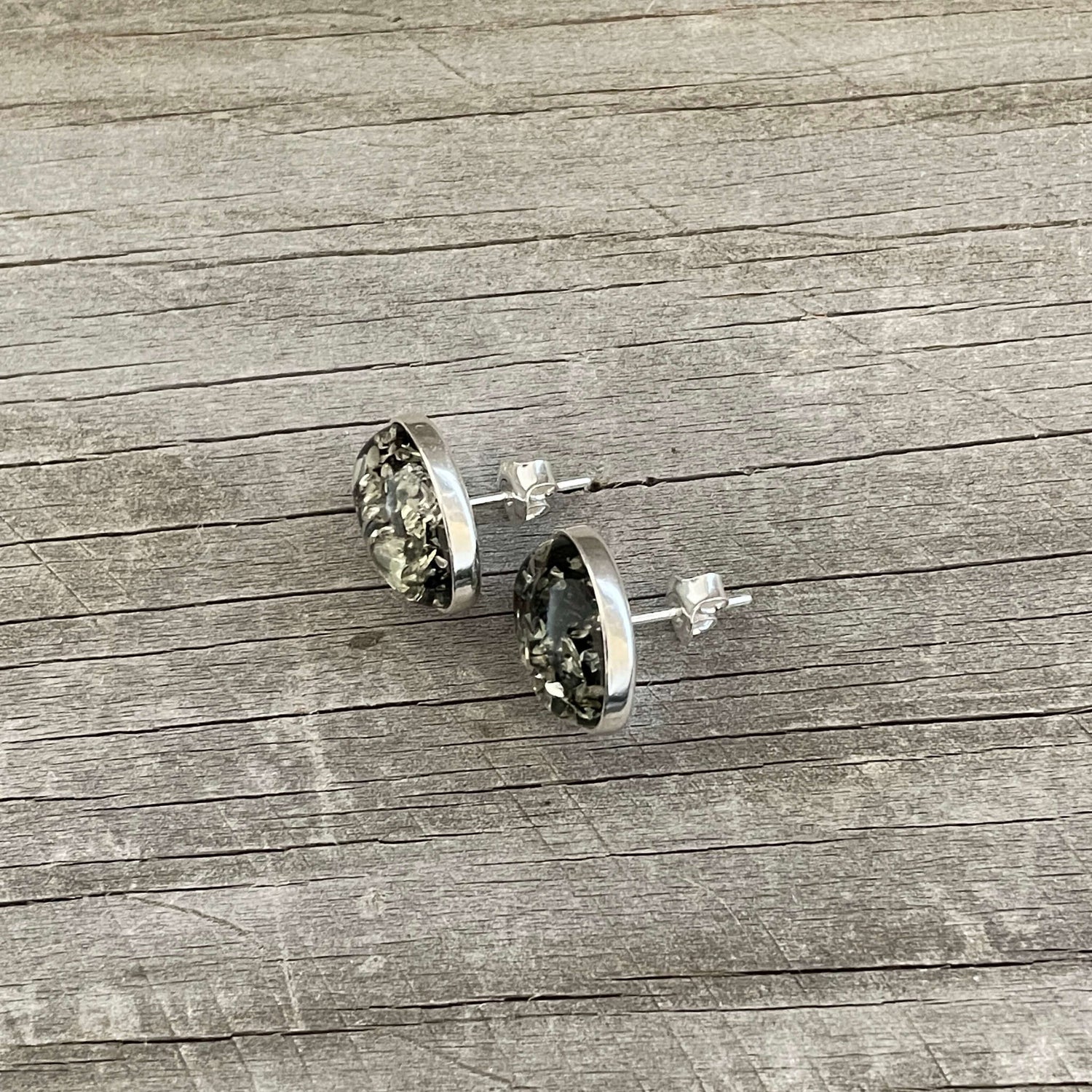 oval shaped polished green amber stud earrings