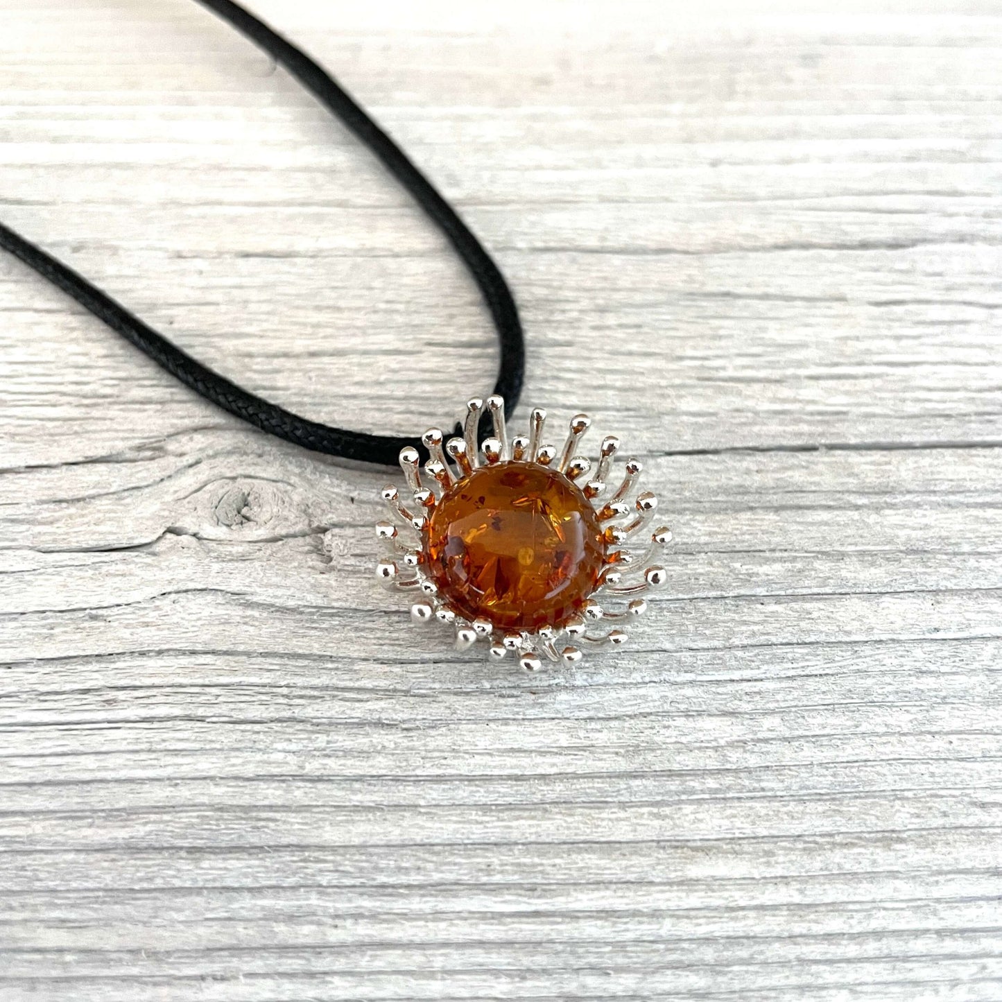 flower shaped cognac amber pendant