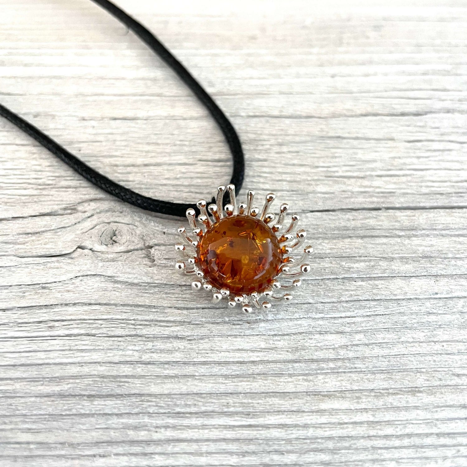 flower shaped cognac amber pendant