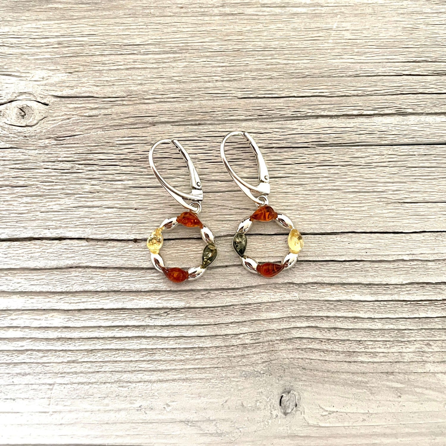 cognac honey and green amber set in round shaped earrings