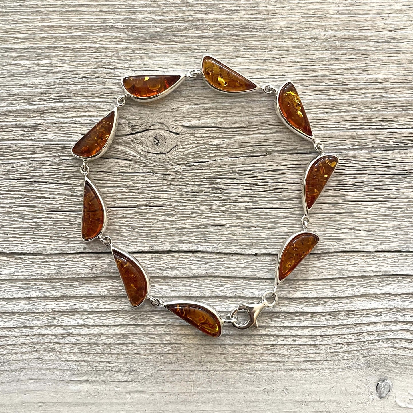 half moon shaped cognac amber set in sterling silver