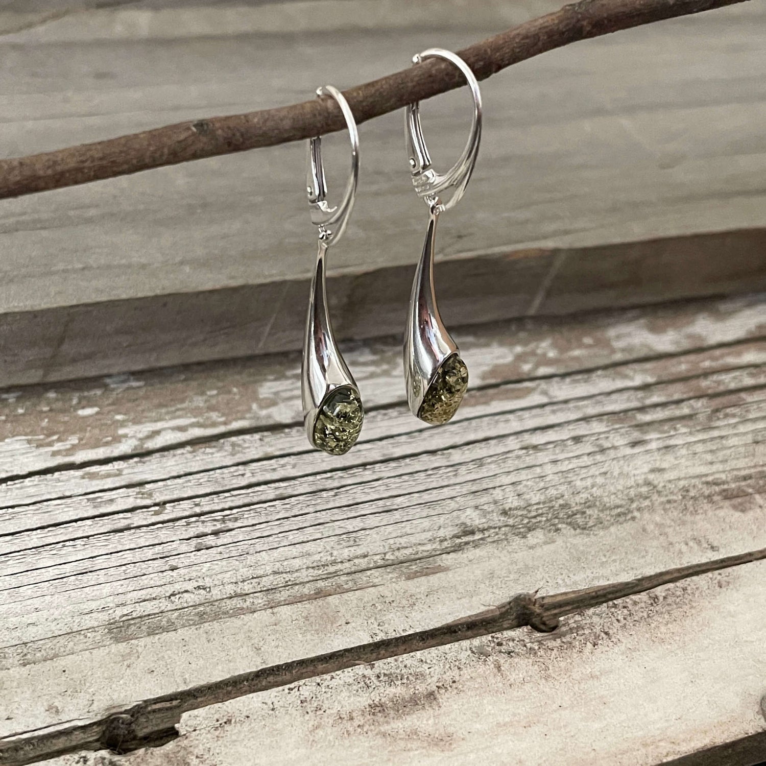 long dangling sterling silver earrings with green amber