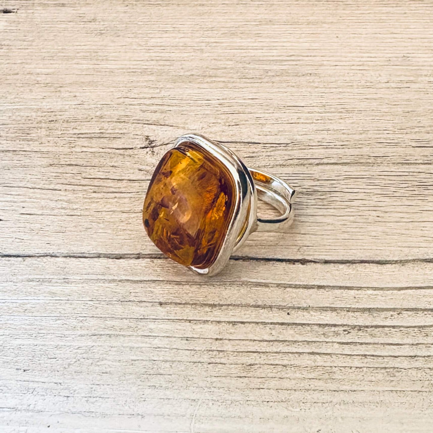 adjustable cognac amber ring set in sterling silver right side