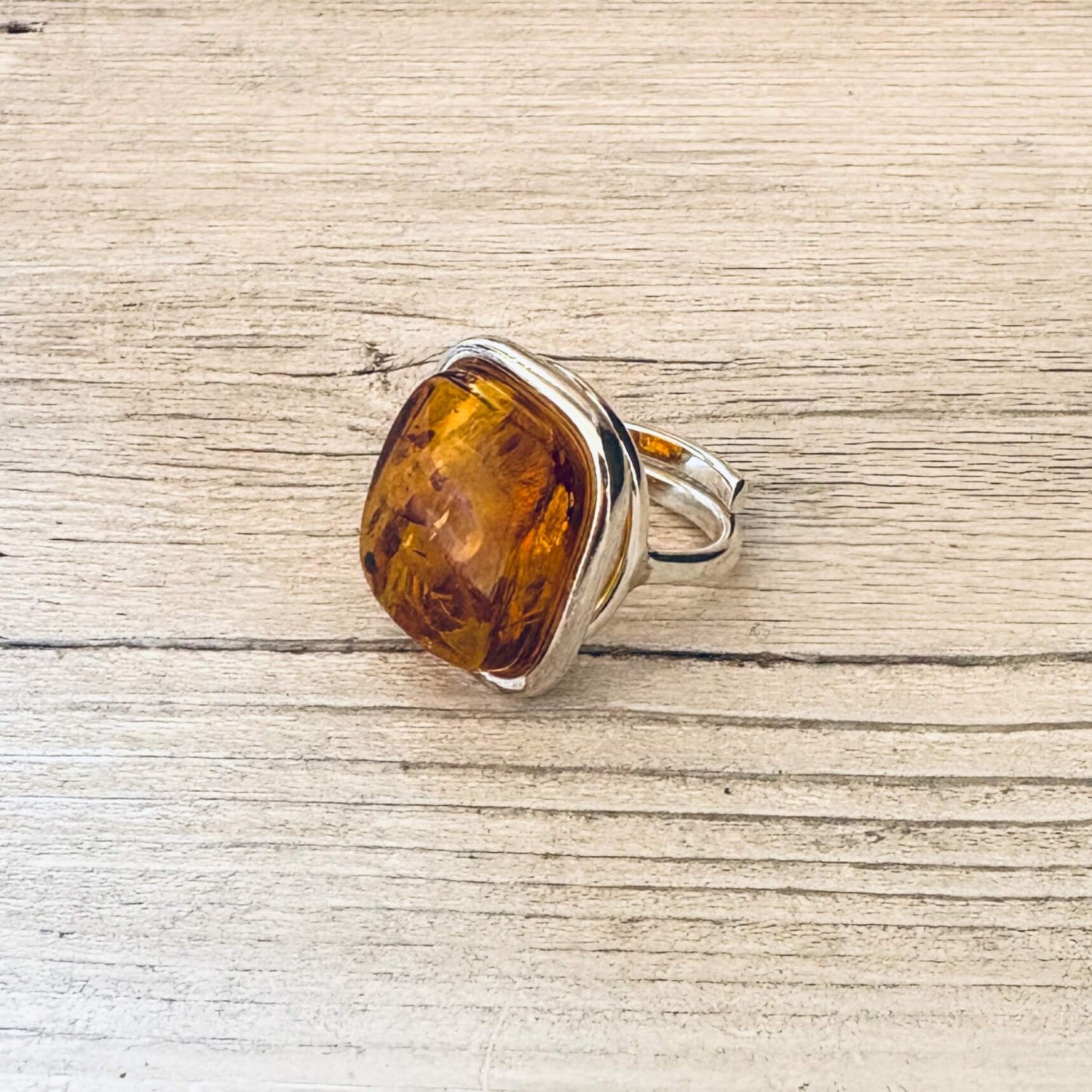 adjustable cognac amber ring set in sterling silver right side