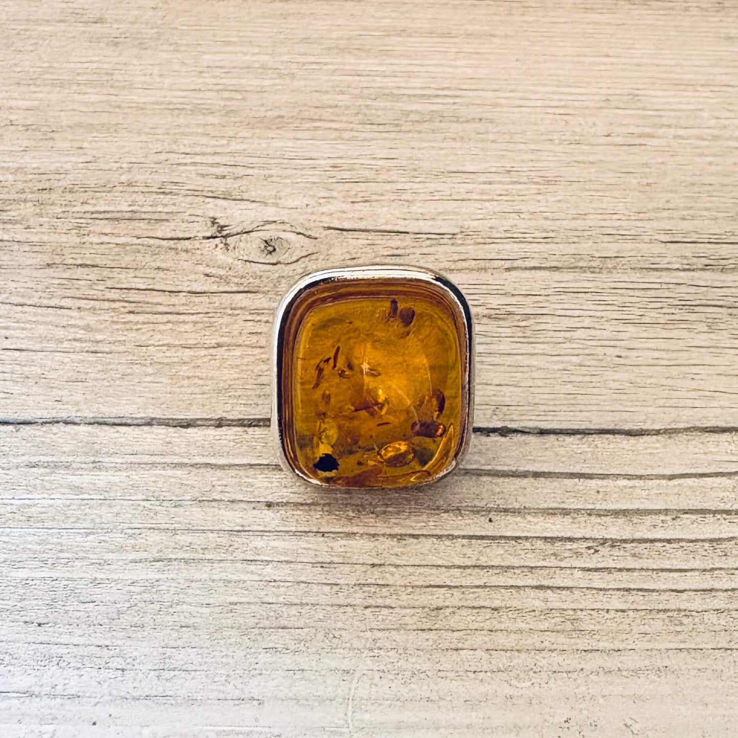 adjustable cognac amber ring set in sterling silver front