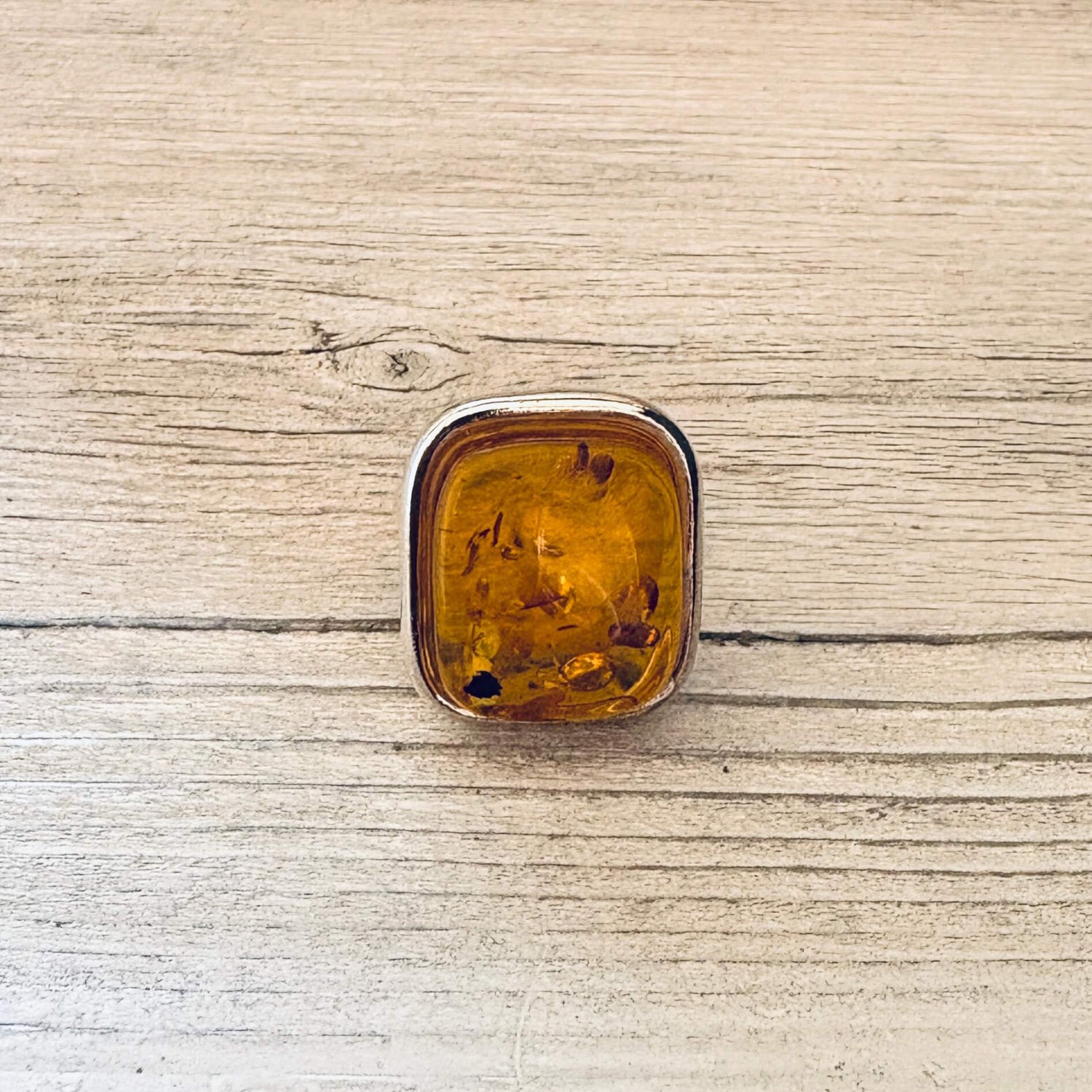 adjustable cognac amber ring set in sterling silver front