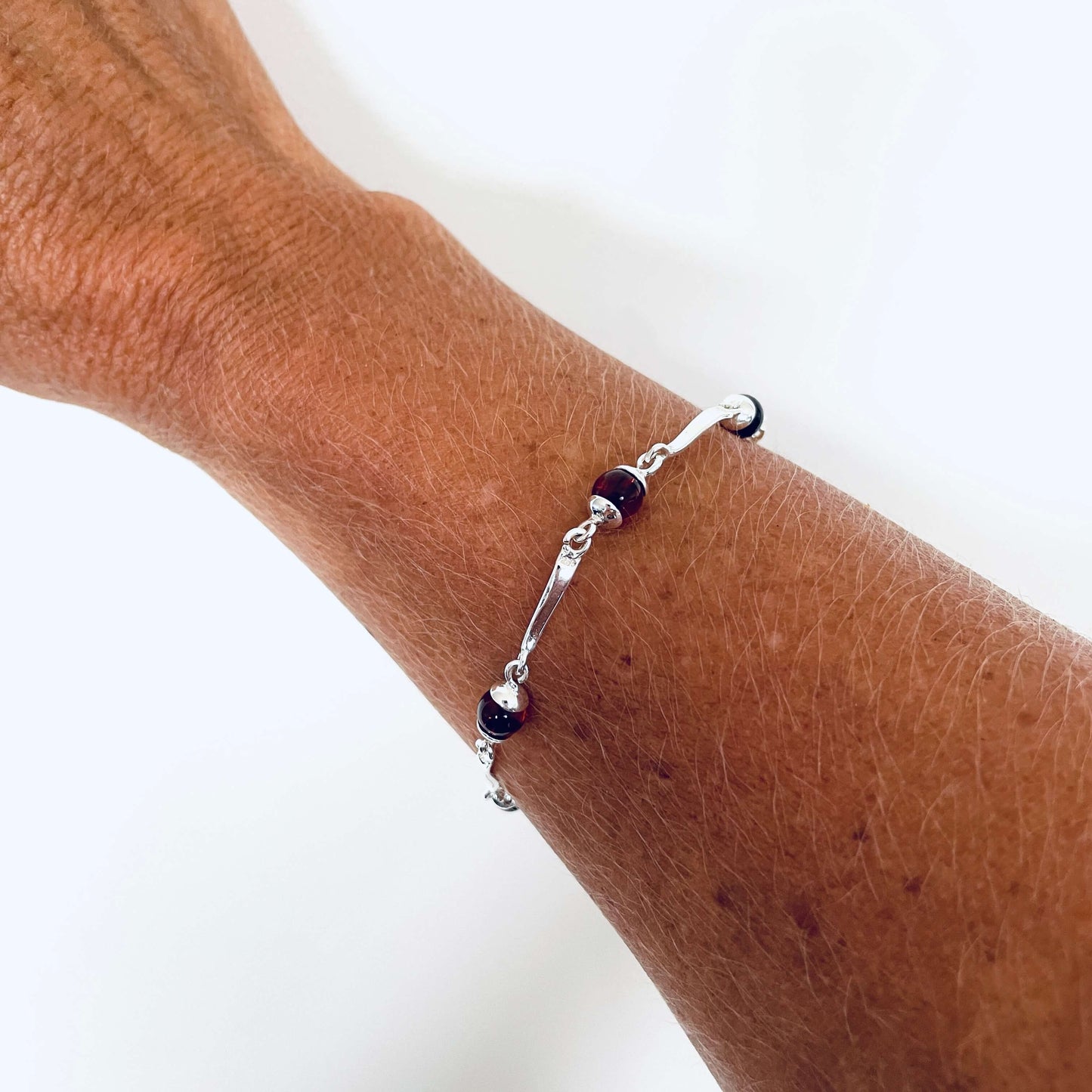 Sterling silver bracelet with round cognac amber set in sterling silver