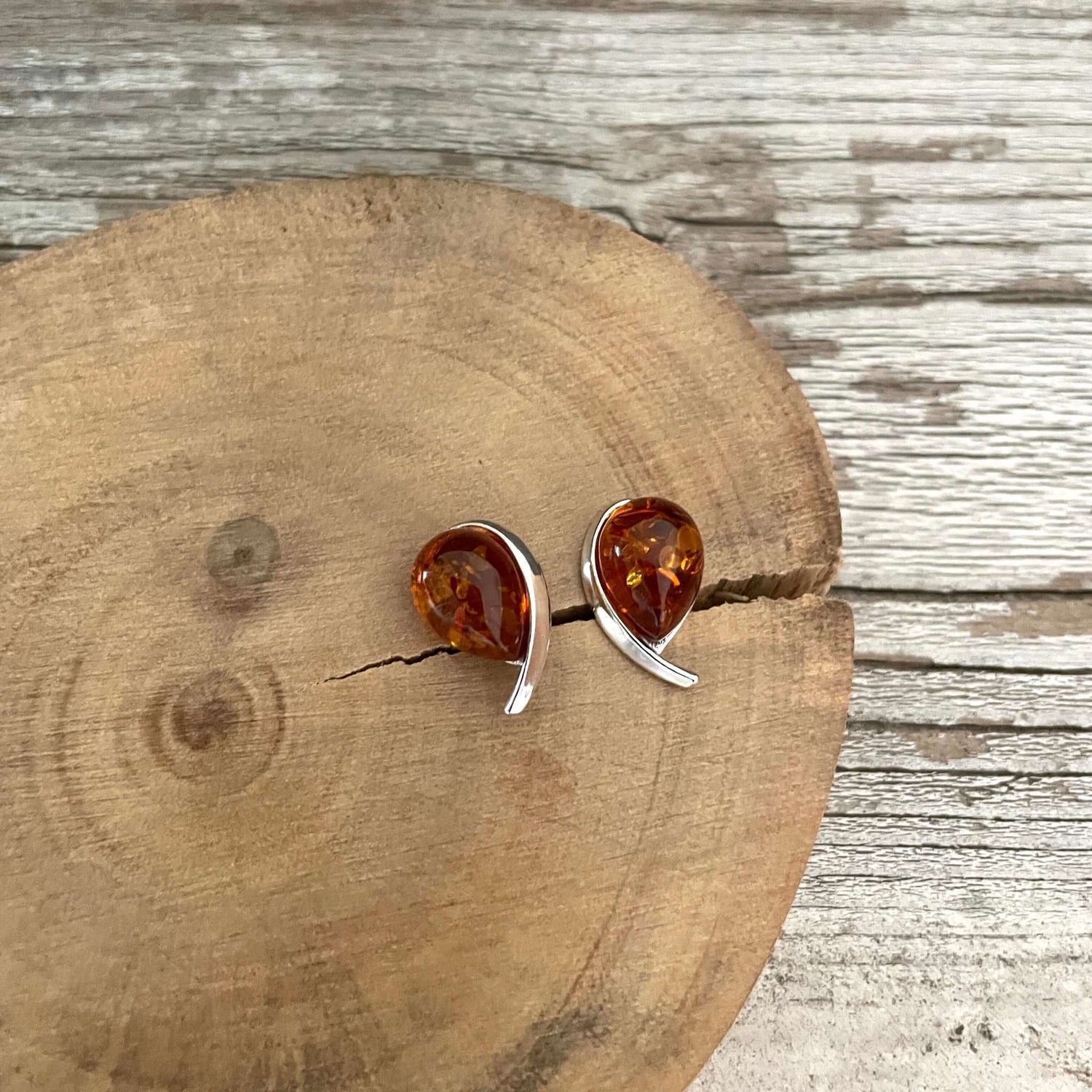 tear drop shaped cognac amber stud earrings set in sterling silver