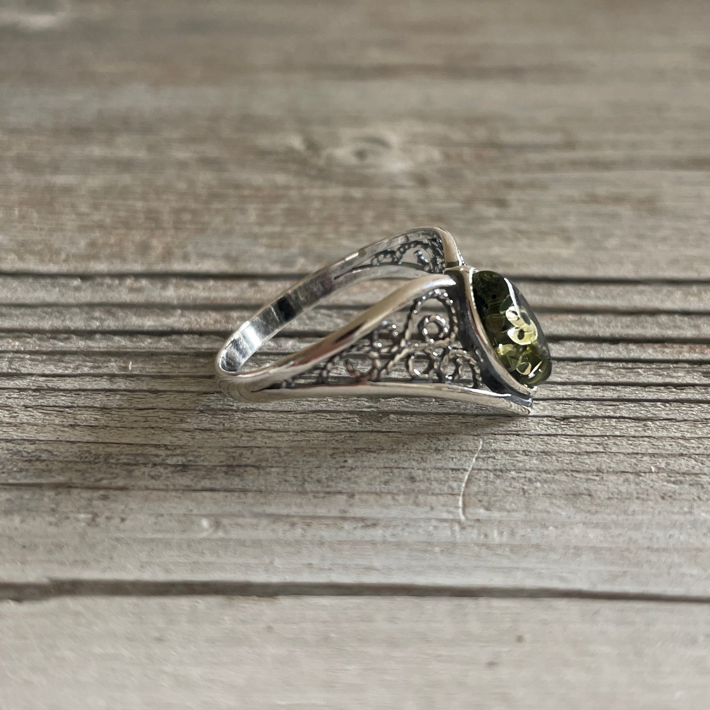 oval shaped green amber ring set in sterling silver right side