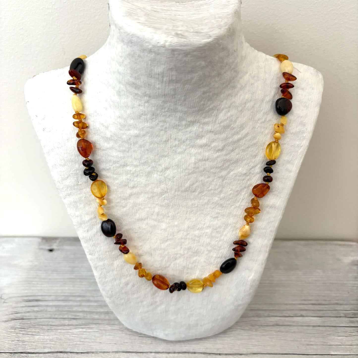 polished beaded mixed coloured amber necklace