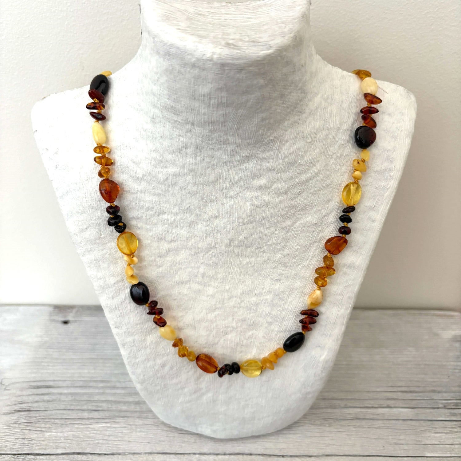 polished beaded mixed coloured amber necklace