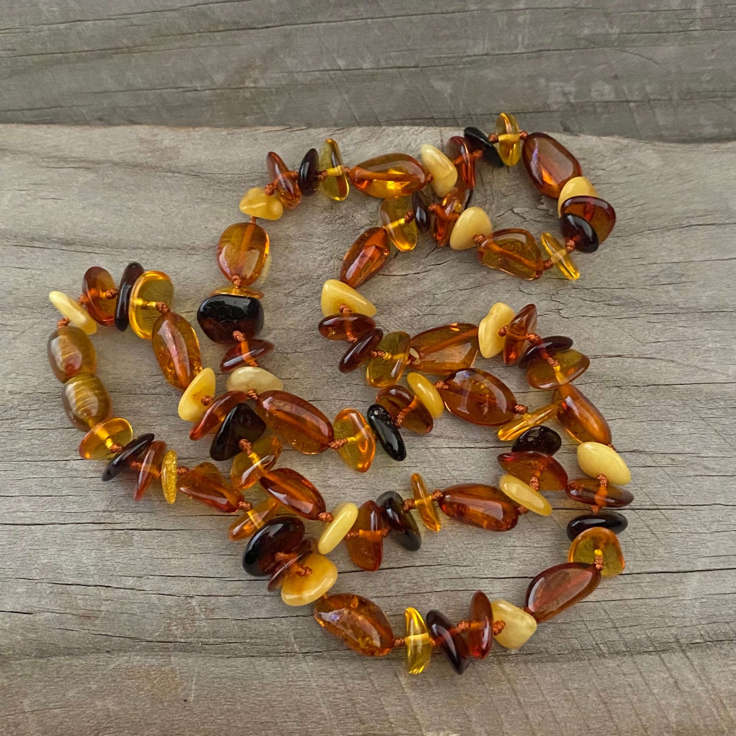 polished beaded mixed coloured amber necklace