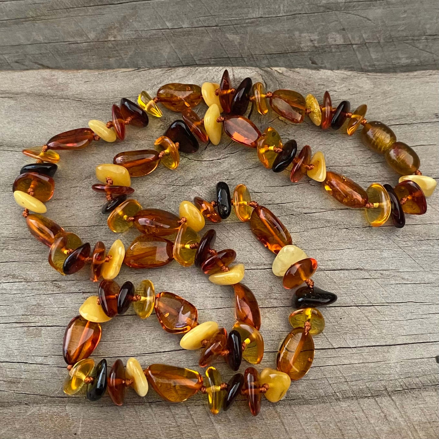 polished beaded mixed coloured amber necklace