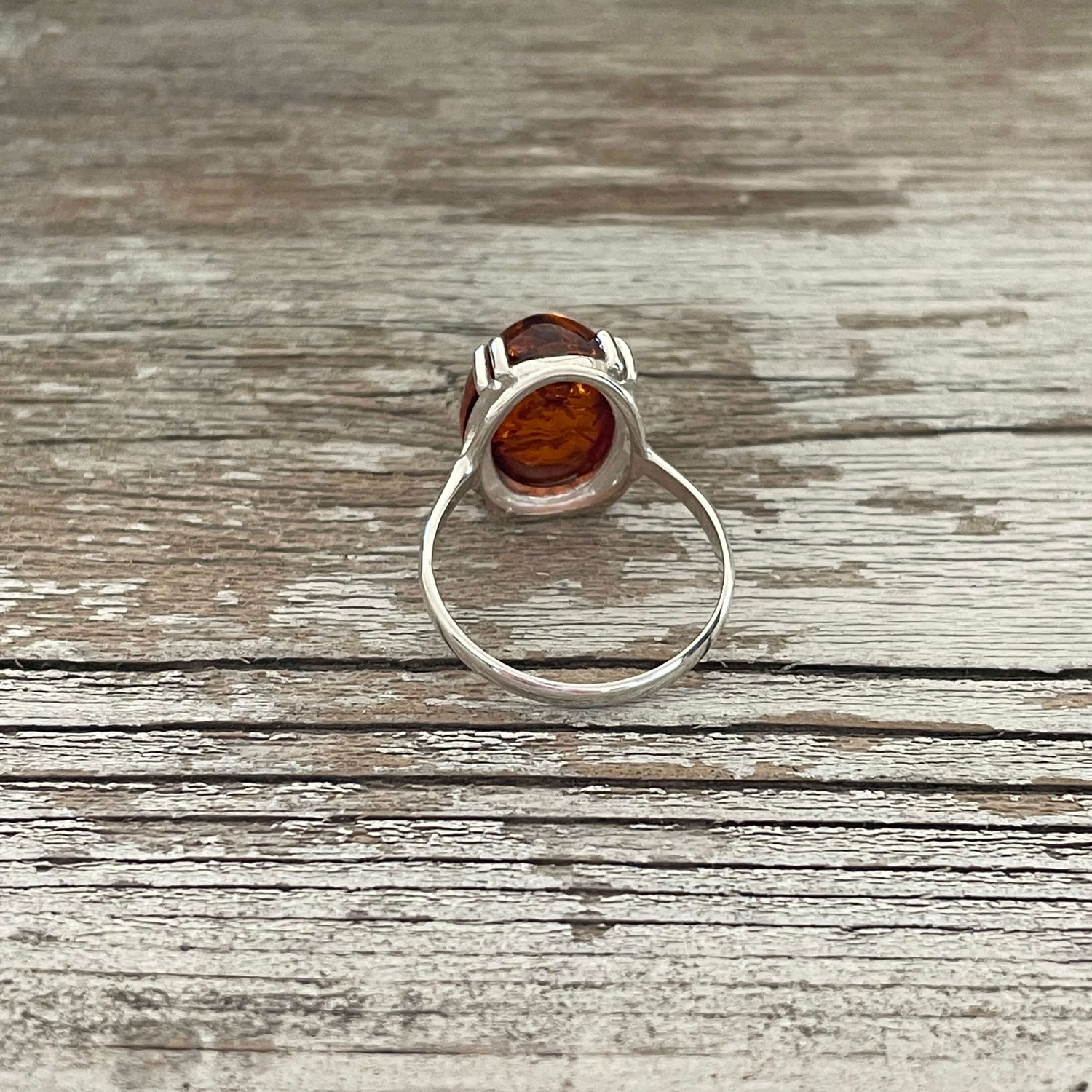 egg shaped cognac amber ring set in sterling silver