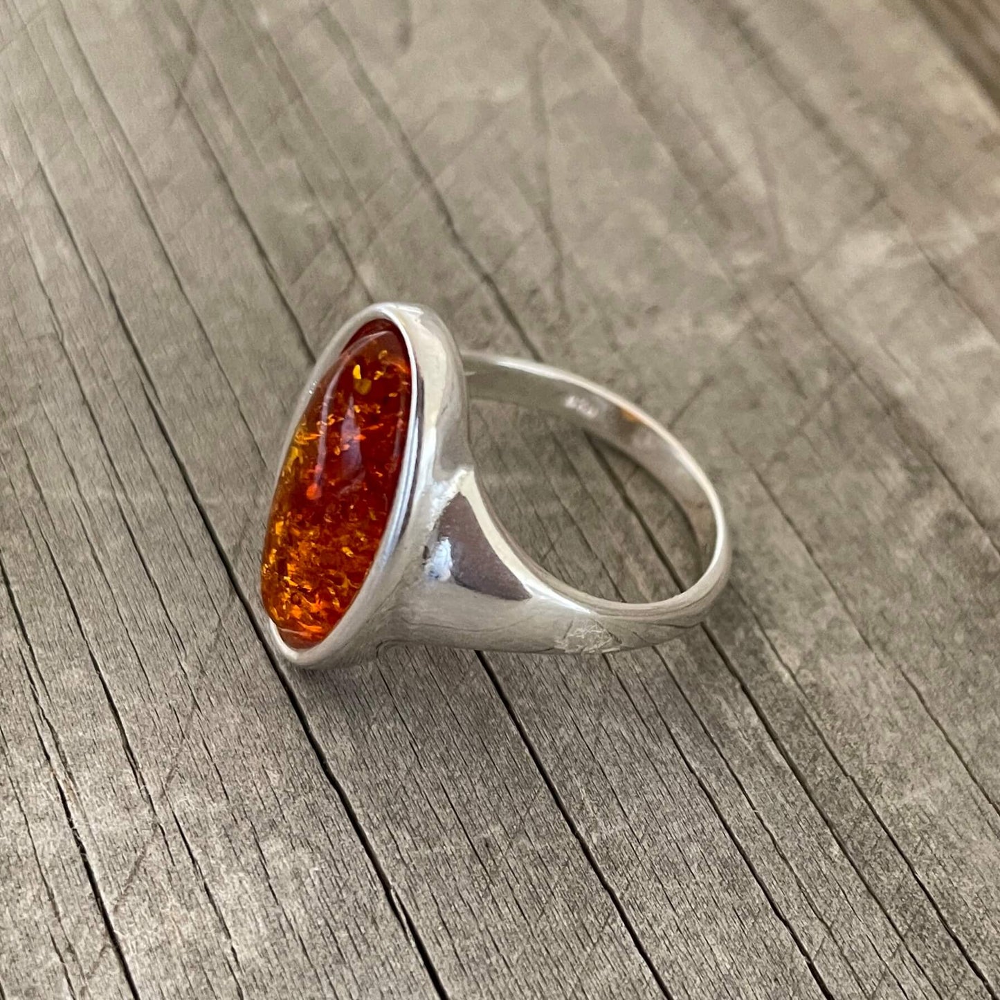 oval shaped cognac amber set in sterling silver ring