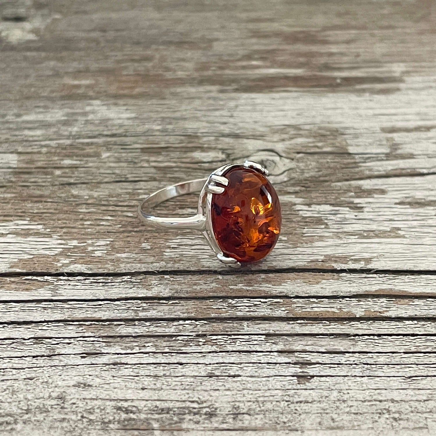 egg shaped cognac amber ring set in sterling silver