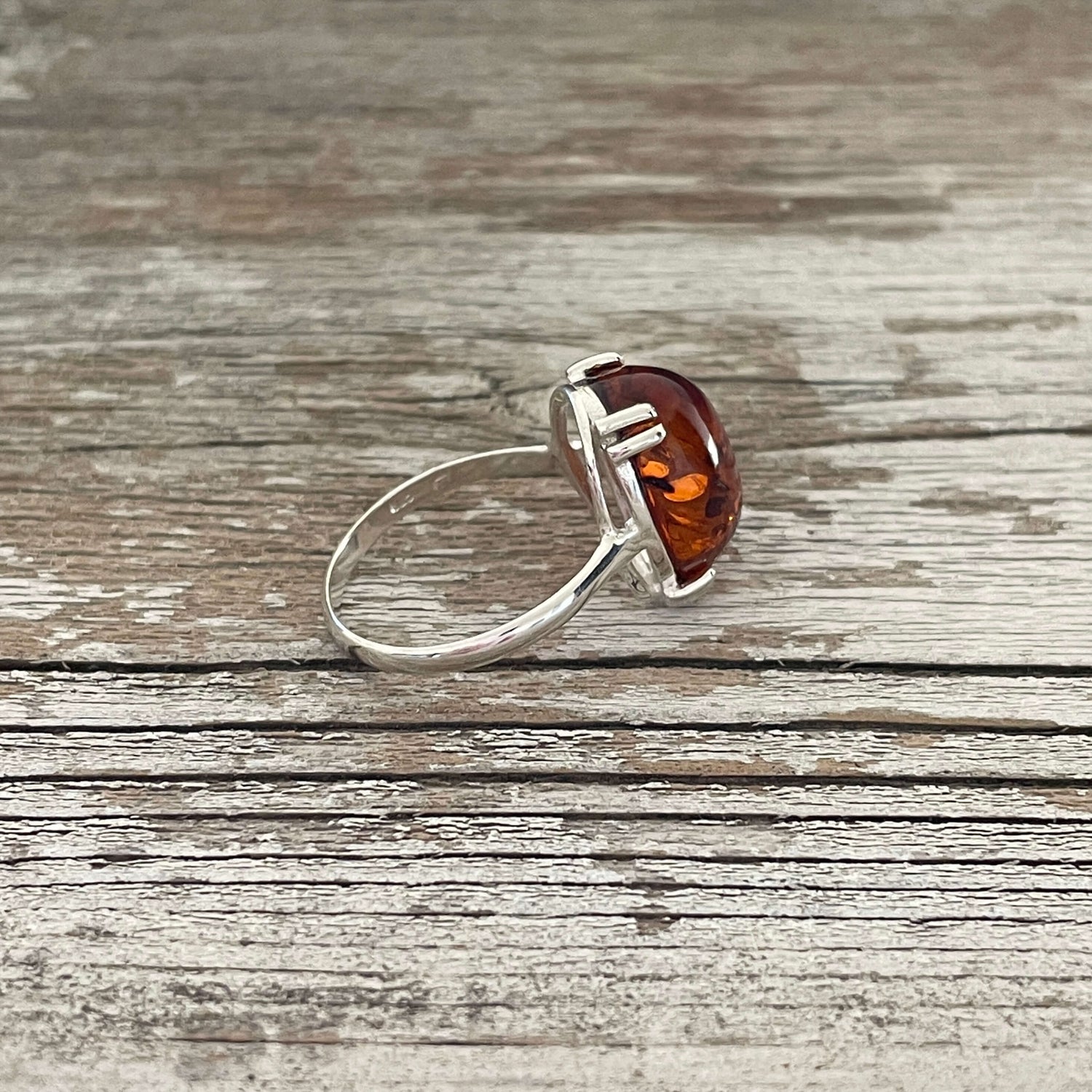 egg shaped cognac amber ring set in sterling silver