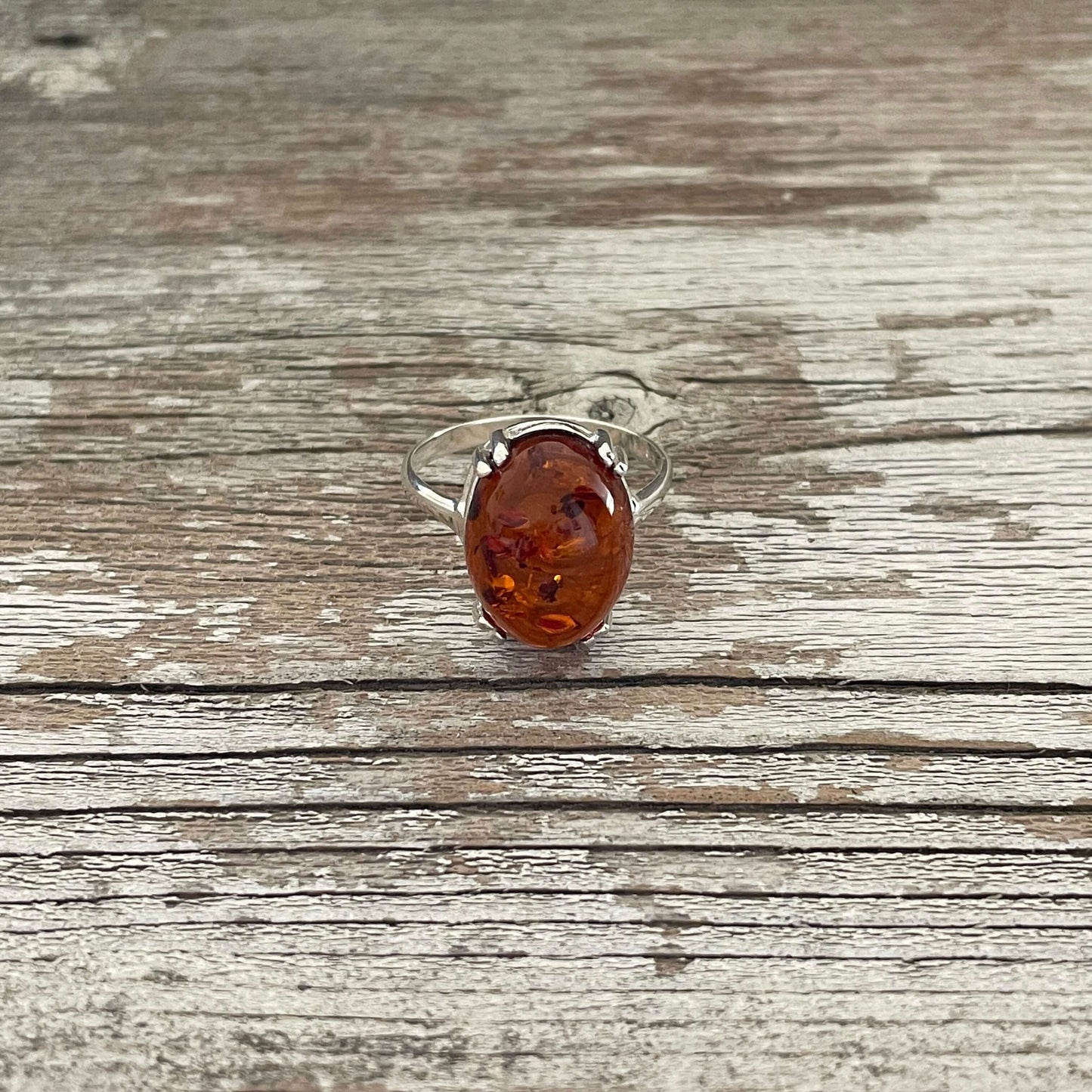 egg shaped cognac amber ring set in sterling silver