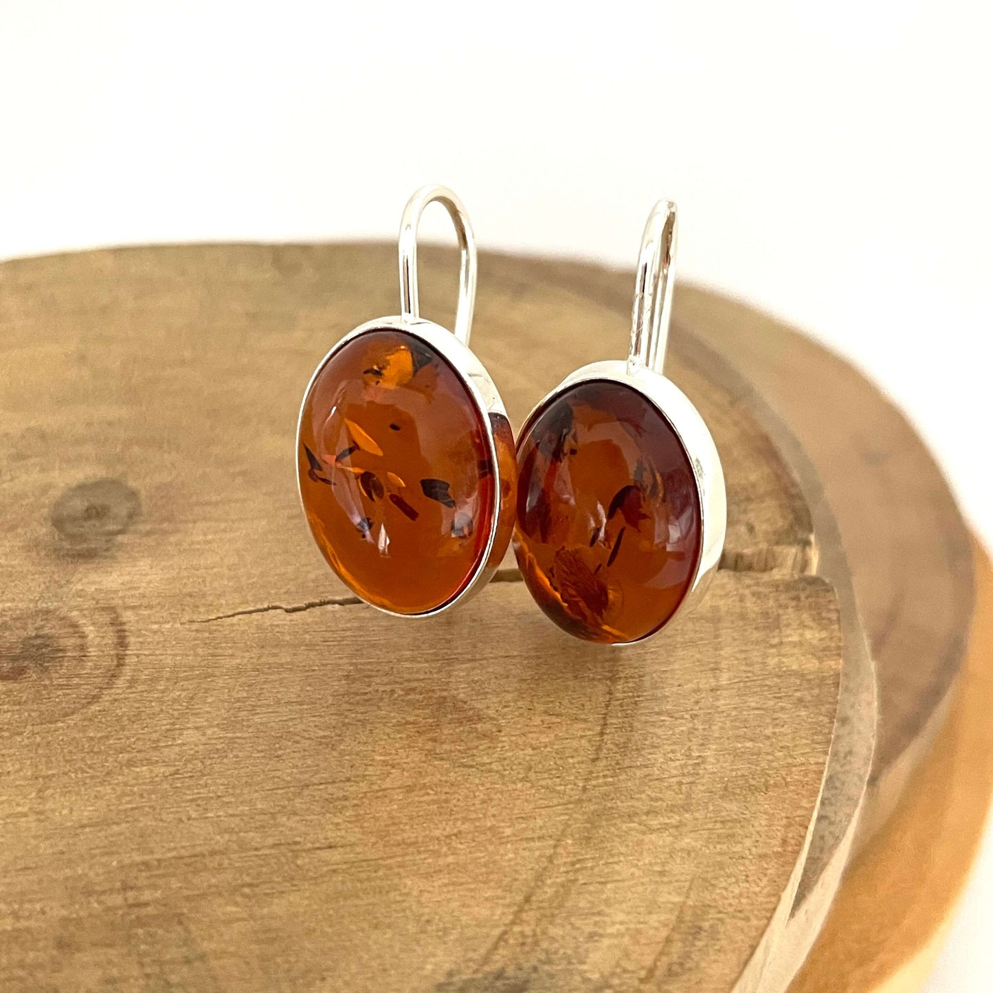 cognac amber oval shaped hook earrings front