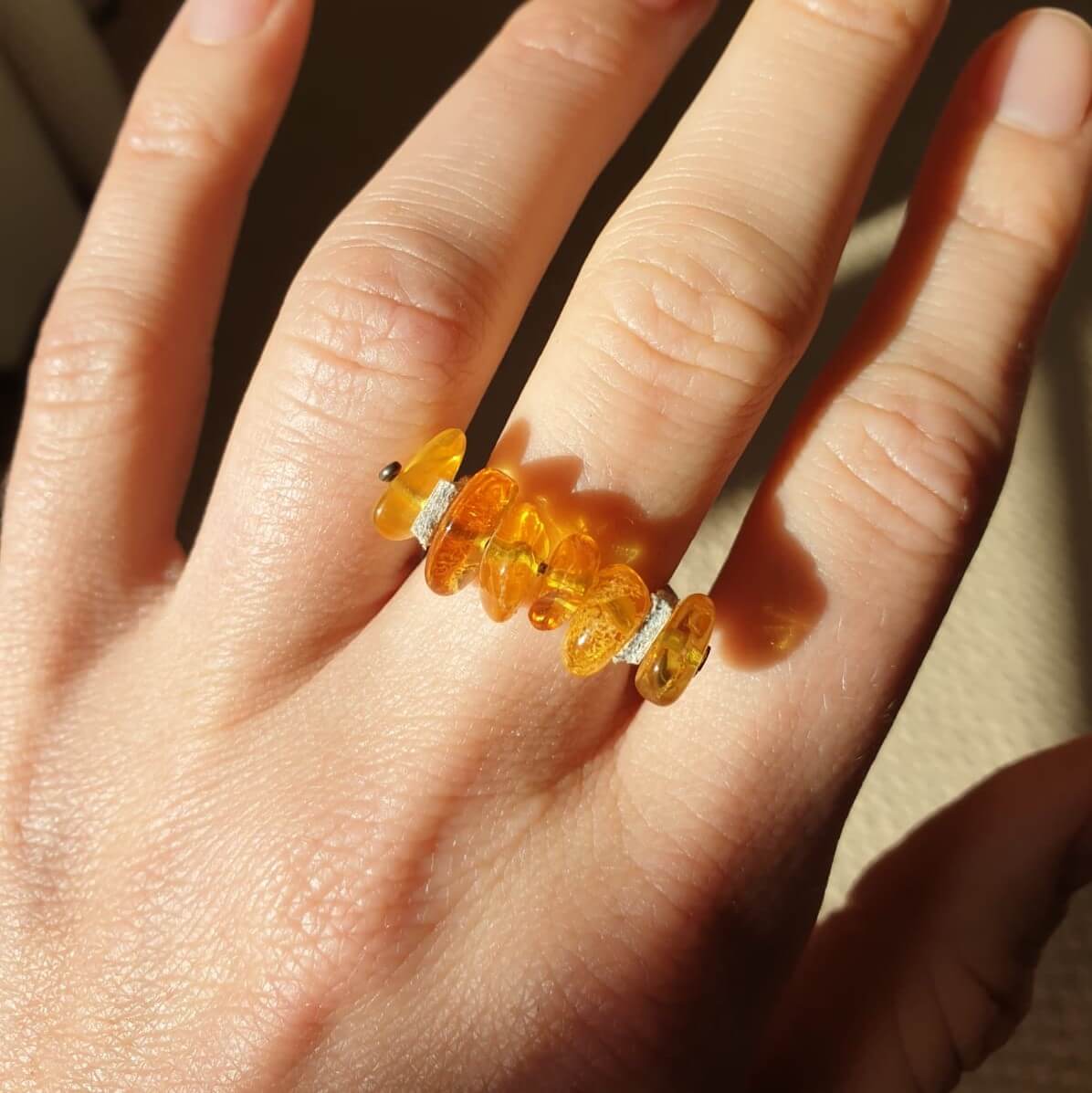cognac amber nuggets on a fawn coloured  leather band