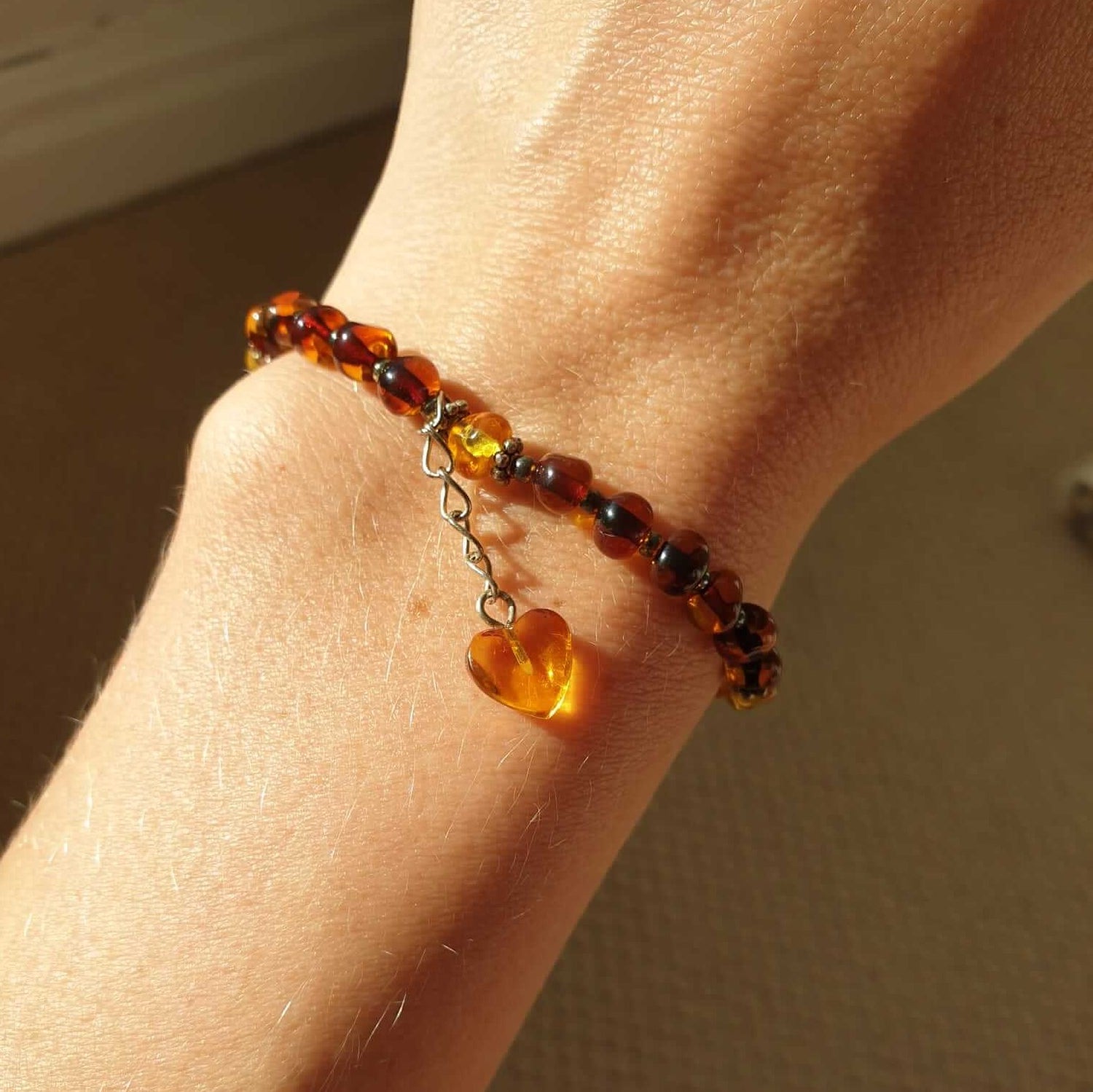 Baltic amber greenish beaded bracelet with a love heart