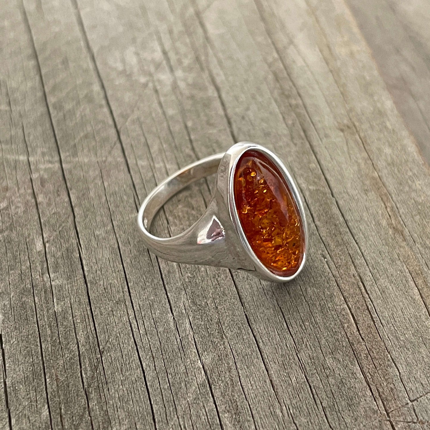 oval shaped cognac amber set in sterling silver ring