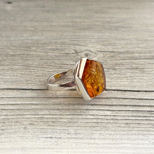 left side adjustable amber ring set in sterling silver