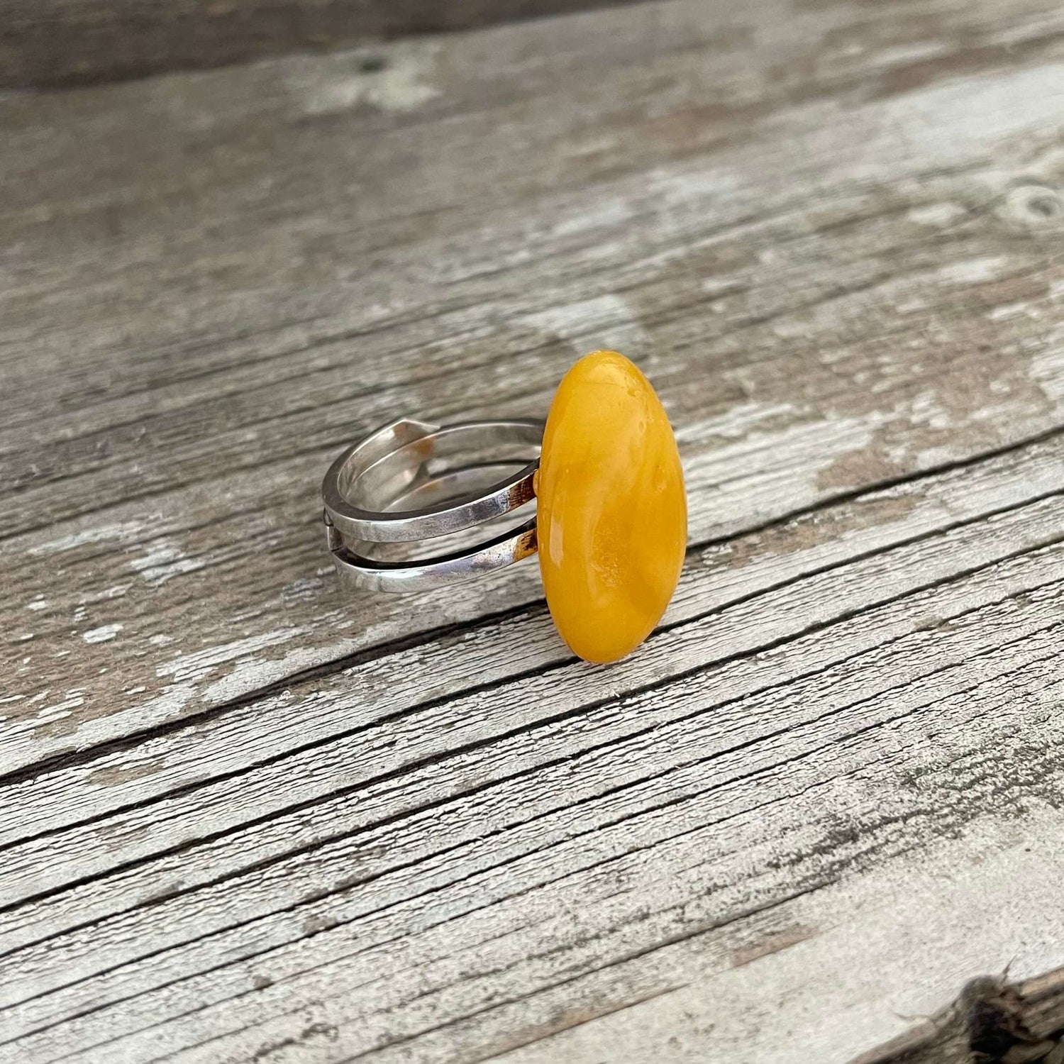 polished yellow amber ring on sterling silver band