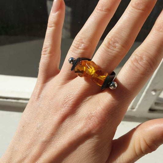 polished cognac amber with a leather black band