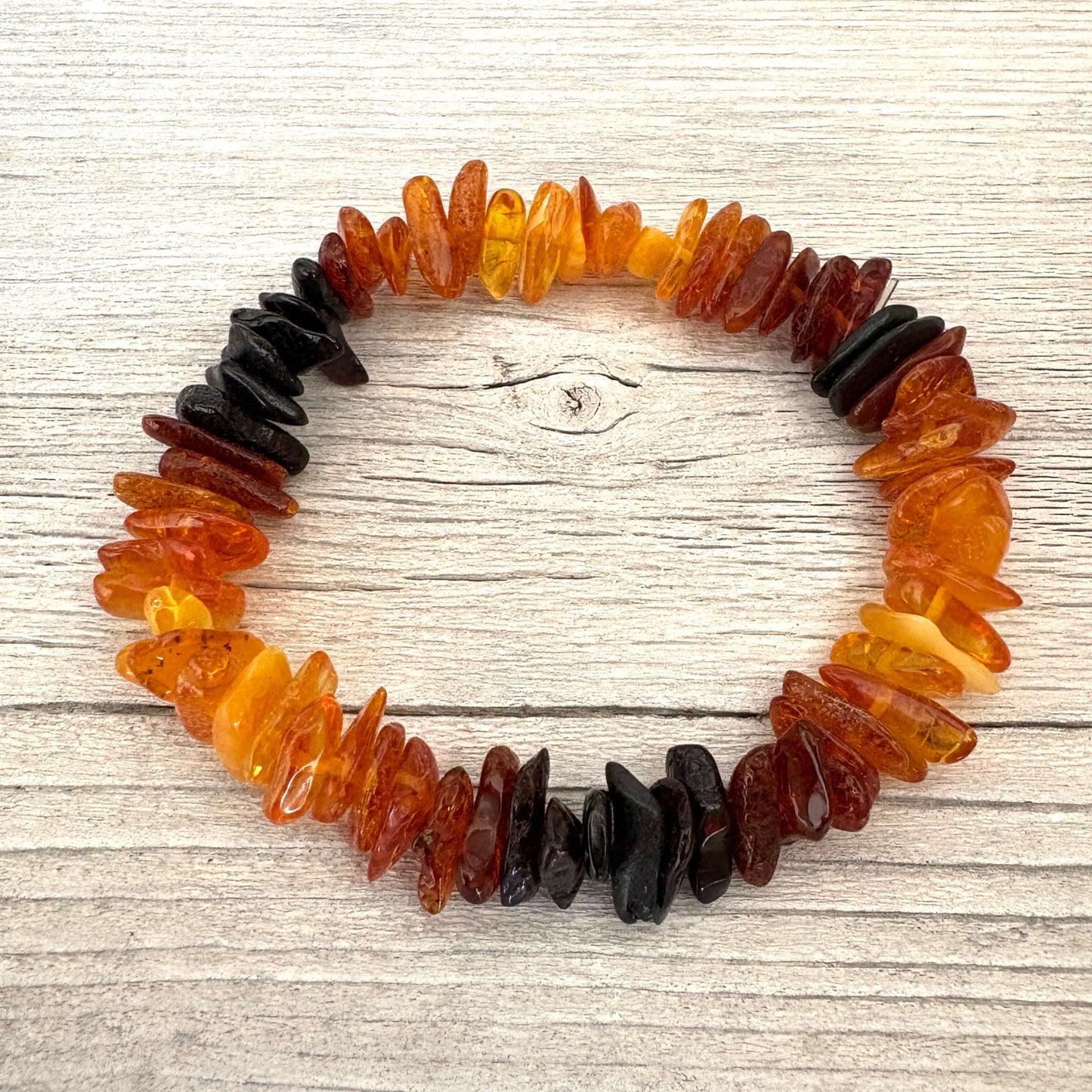 Multicolored beaded bracelet on a wooden surface