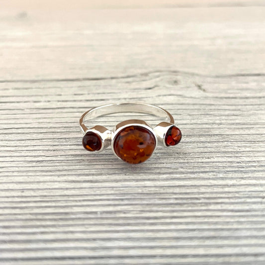 three round shaped amber stone ring